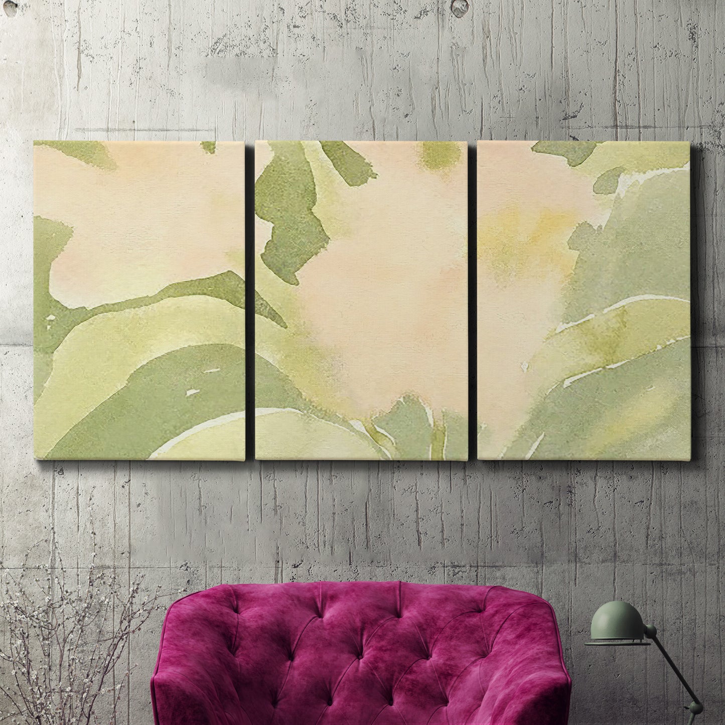Three-panel canvas wall art featuring minimal verdant floral abstraction, displayed in a living room above a suede accent chair.