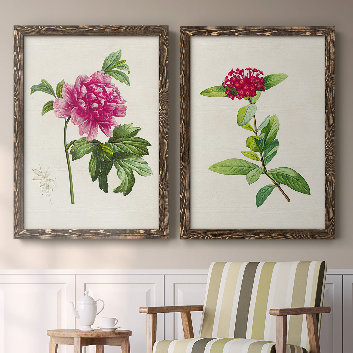 Set of two walnut barnwood framed canvas prints depicting two vintage botanical plate illustrations featuring pink flowering plant specimens above a sideboard in a cozy sitting room.
