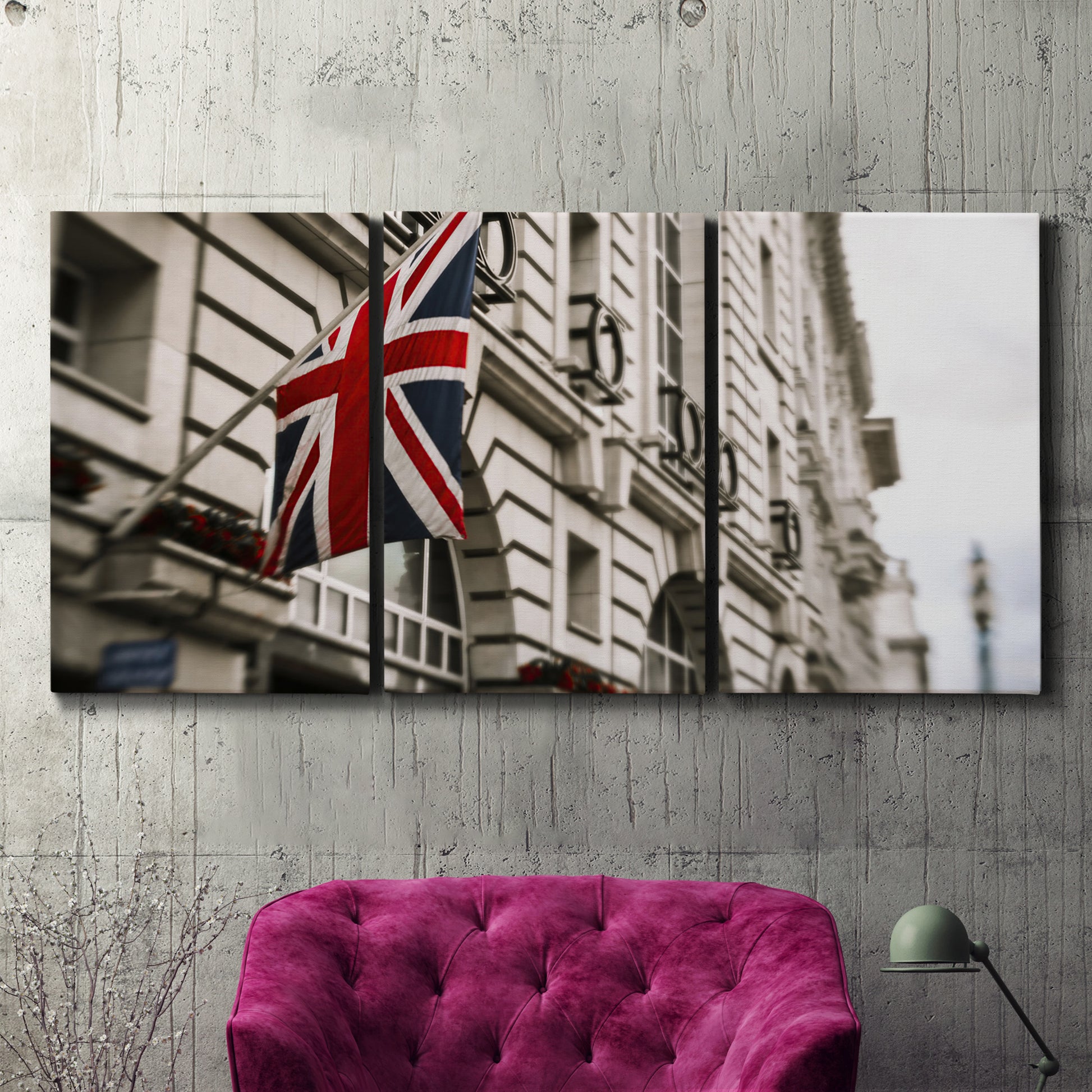 Three-panel canvas wall art featuring london street scene photograph, displayed in a living room above a suede accent chair.