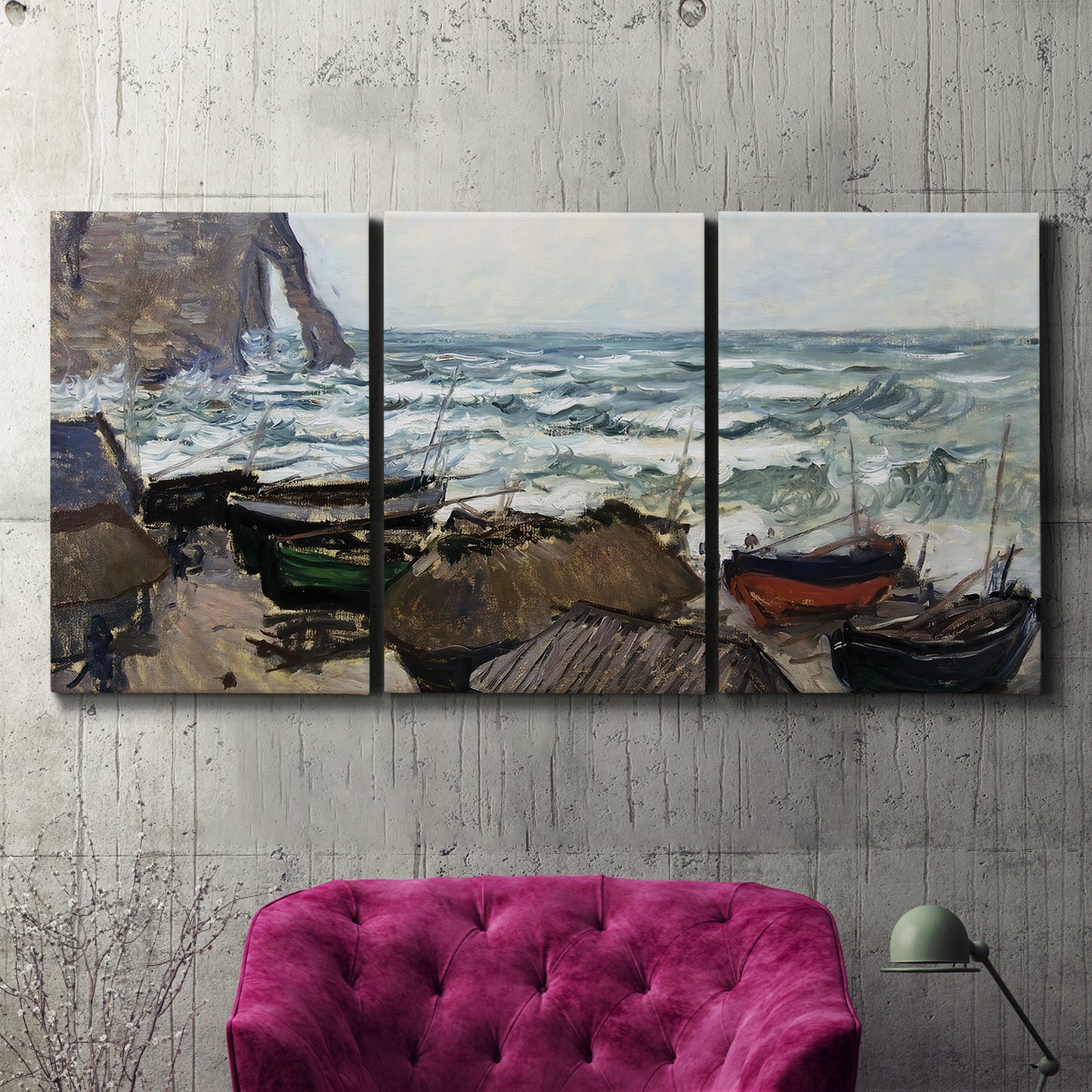 Three-panel canvas wall art featuring rough coastal seas under storm clouds, displayed in a living room above a suede accent chair.