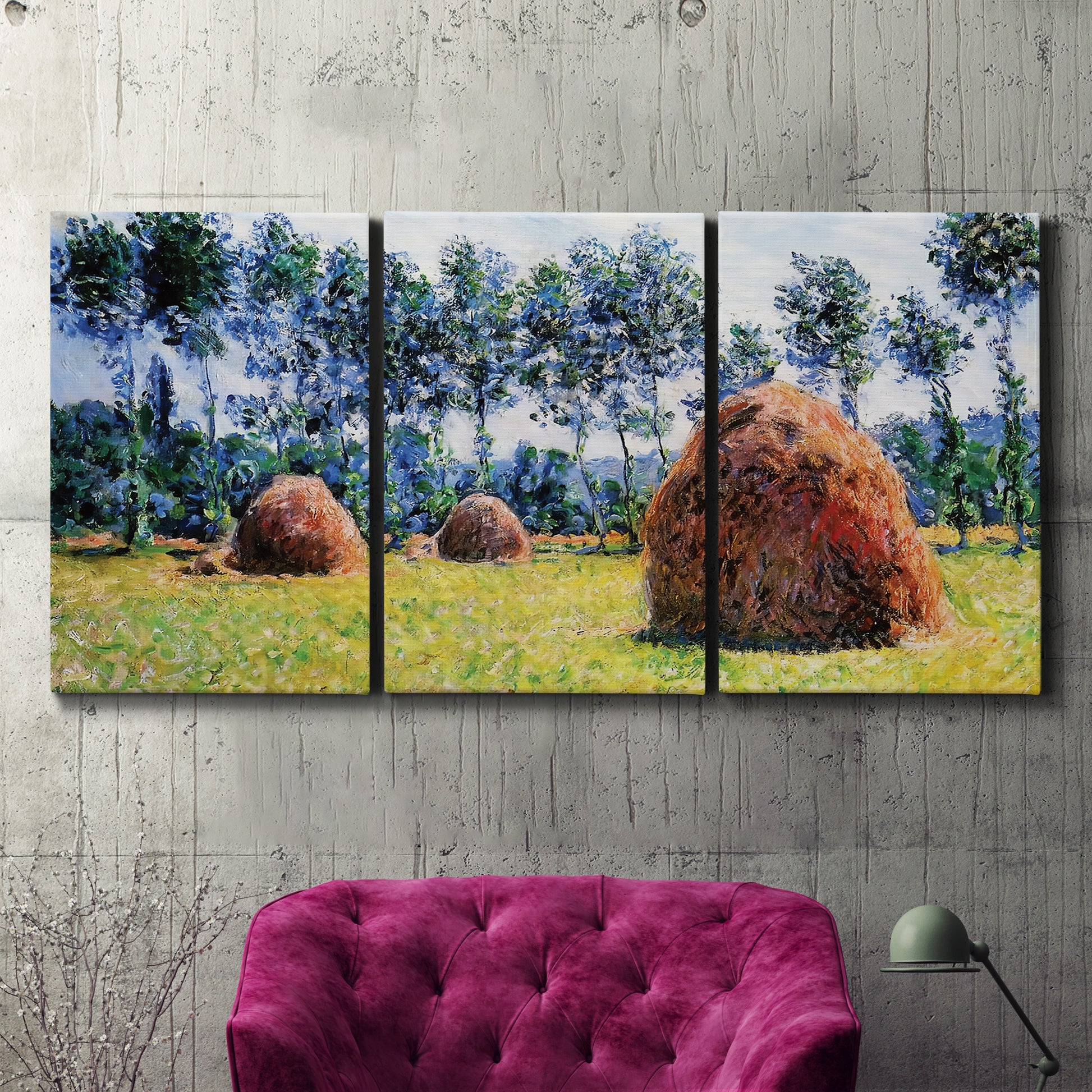 Three-panel canvas wall art featuring harvested grainstacks in field, displayed in a living room above a suede accent chair.