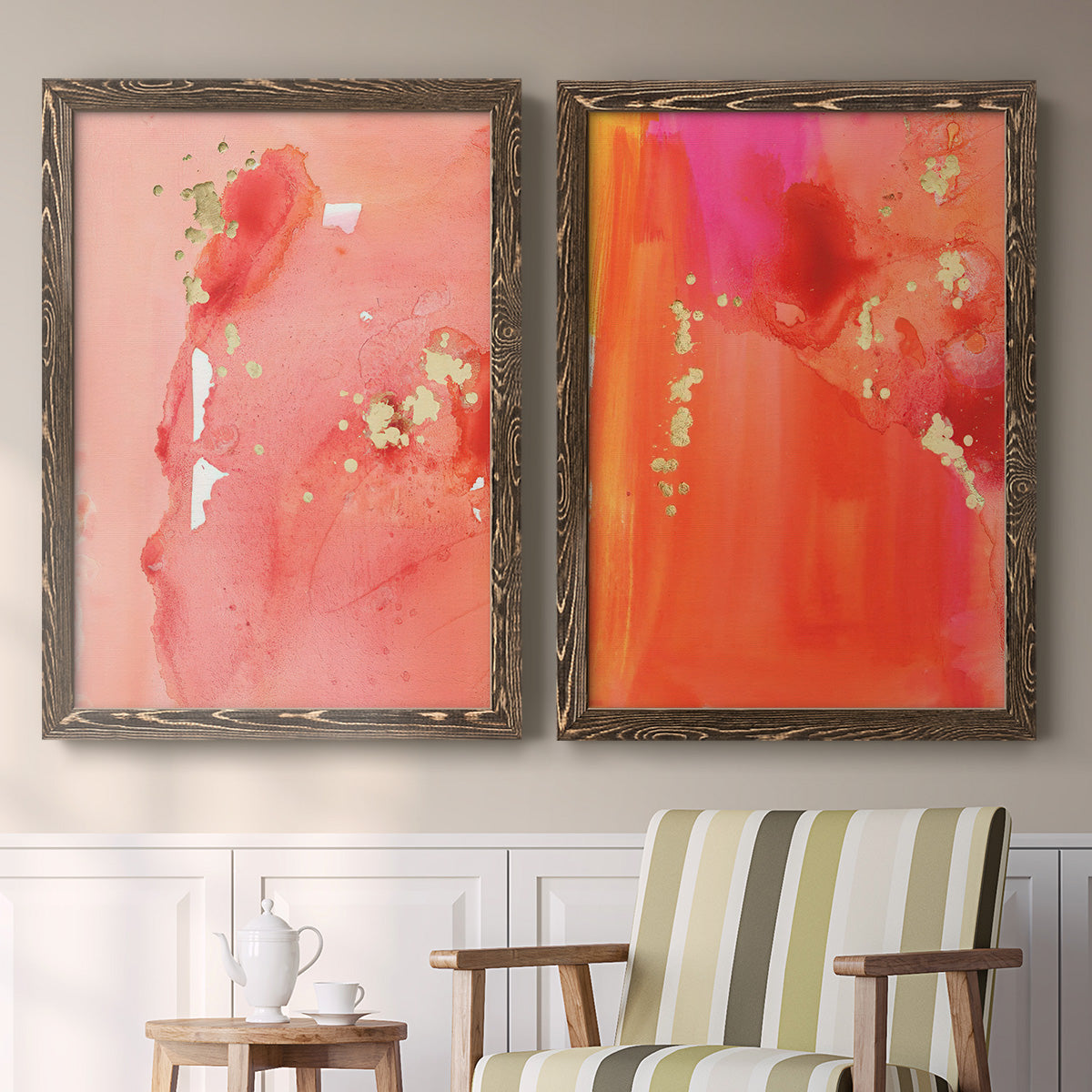 Set of two walnut barnwood framed canvas prints depicting two glamorous fluid abstracts featuring luminous coral orange and pink color fields with gold flecks above a sideboard in a cozy sitting room.