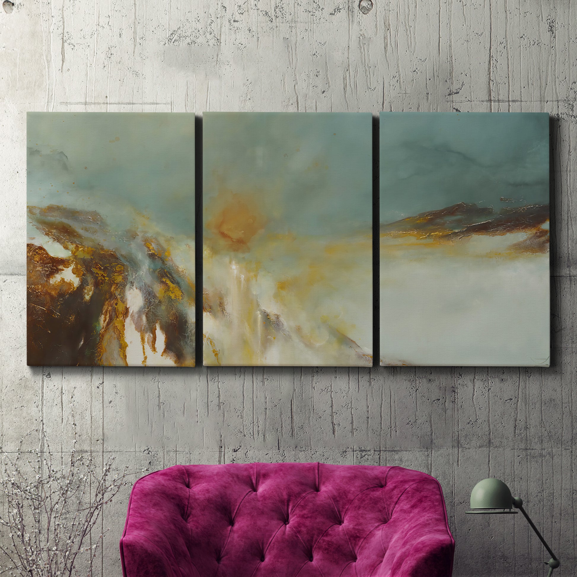 Three-panel canvas wall art featuring earth toned abstract solar landscape, displayed in a living room above a suede accent chair.