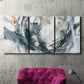 Three-panel canvas wall art featuring repeating abstract geometric array, displayed in a living room above a suede accent chair.