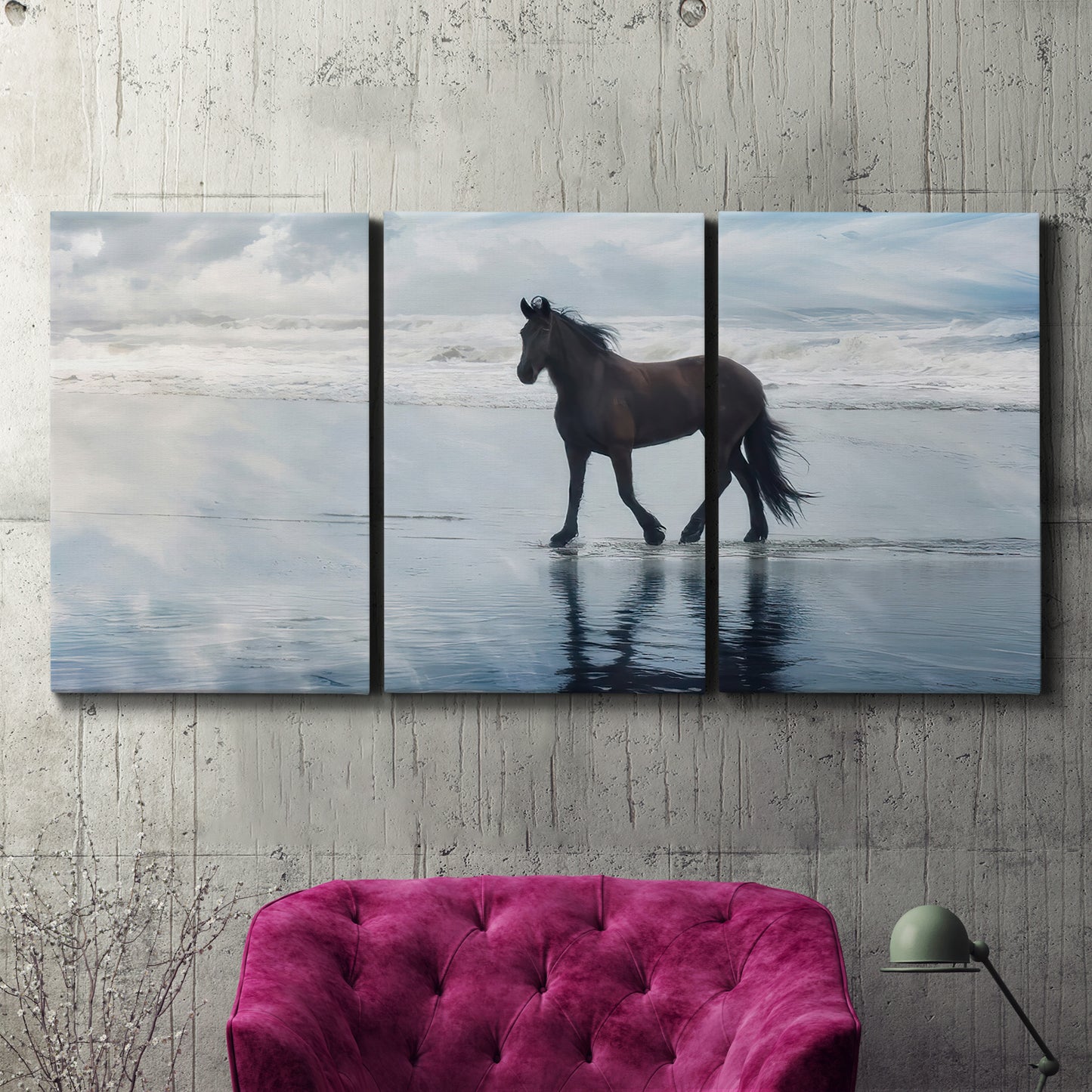 Three-panel canvas wall art featuring running horses captured mid stride, displayed in a living room above a suede accent chair.