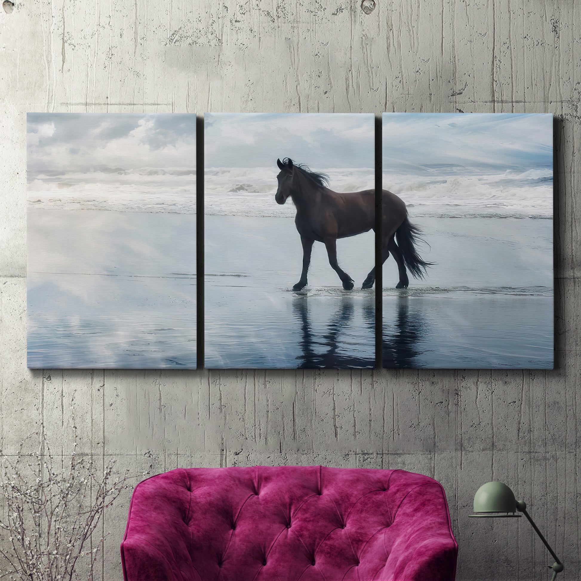 Three-panel canvas wall art featuring running horses captured mid stride, displayed in a living room above a suede accent chair.
