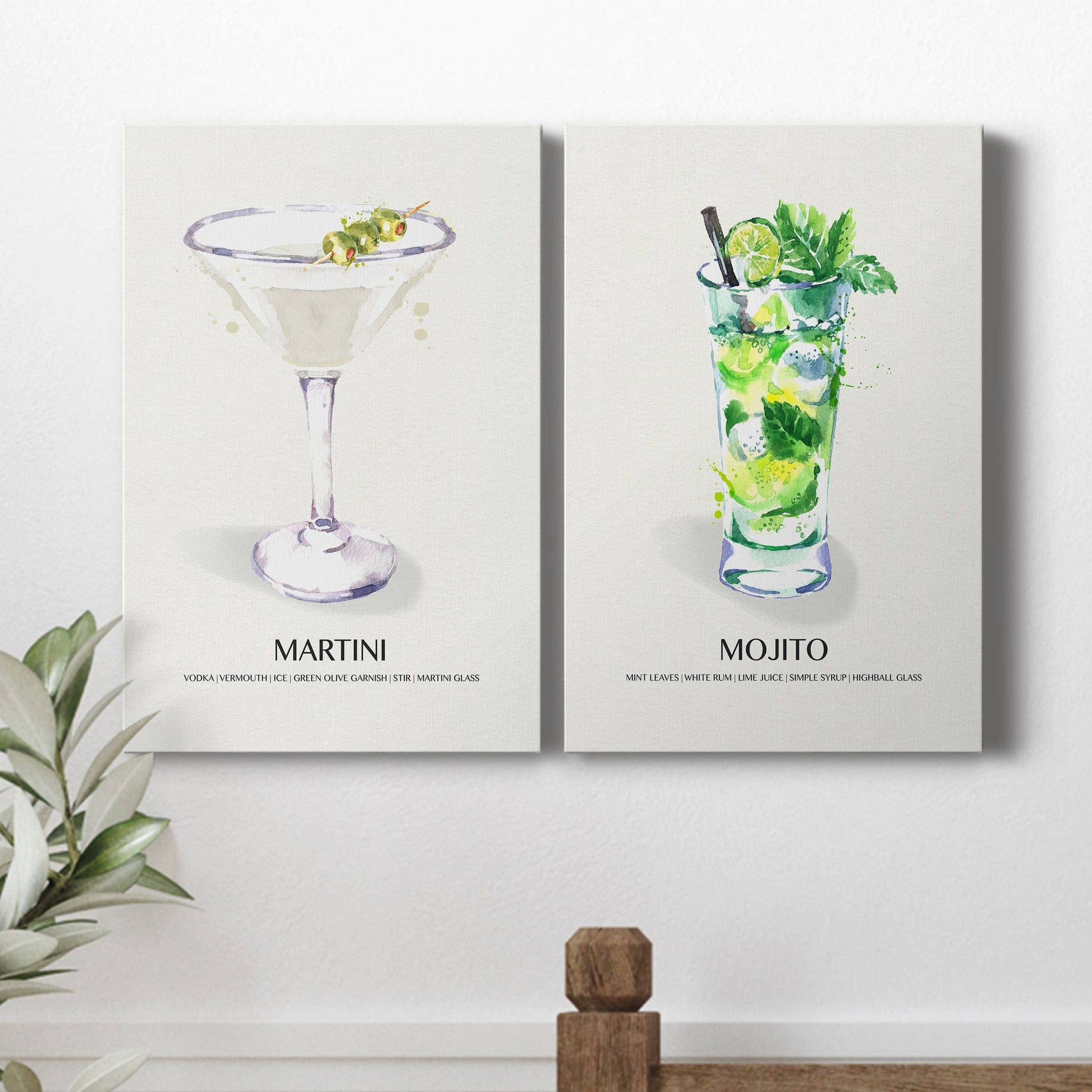 Pair of portrait canvas prints featuring vintage martini cocktail illustration displayed in a light, minimalist interior.