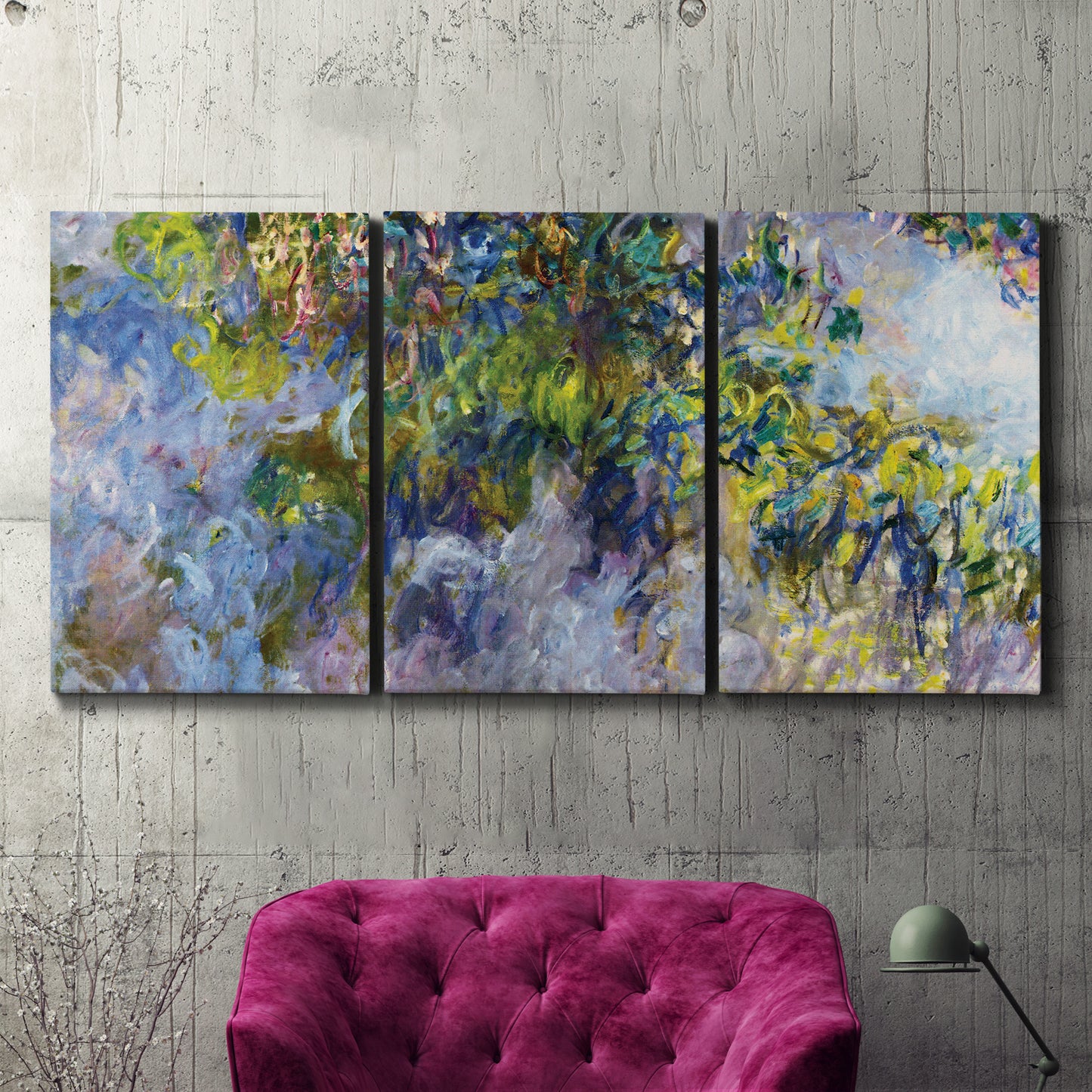 Three-panel canvas wall art featuring cascading purple wisteria blooms, displayed in a living room above a suede accent chair.