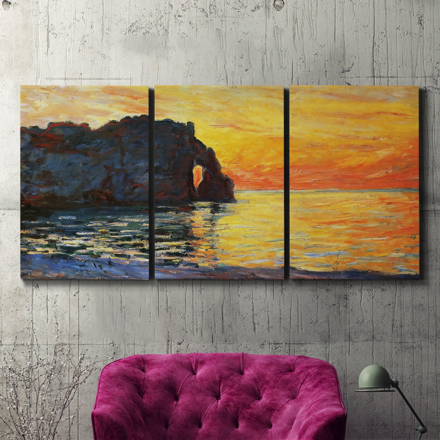 Three-panel canvas wall art featuring arched coastal cliff above sea, displayed in a living room above a suede accent chair.