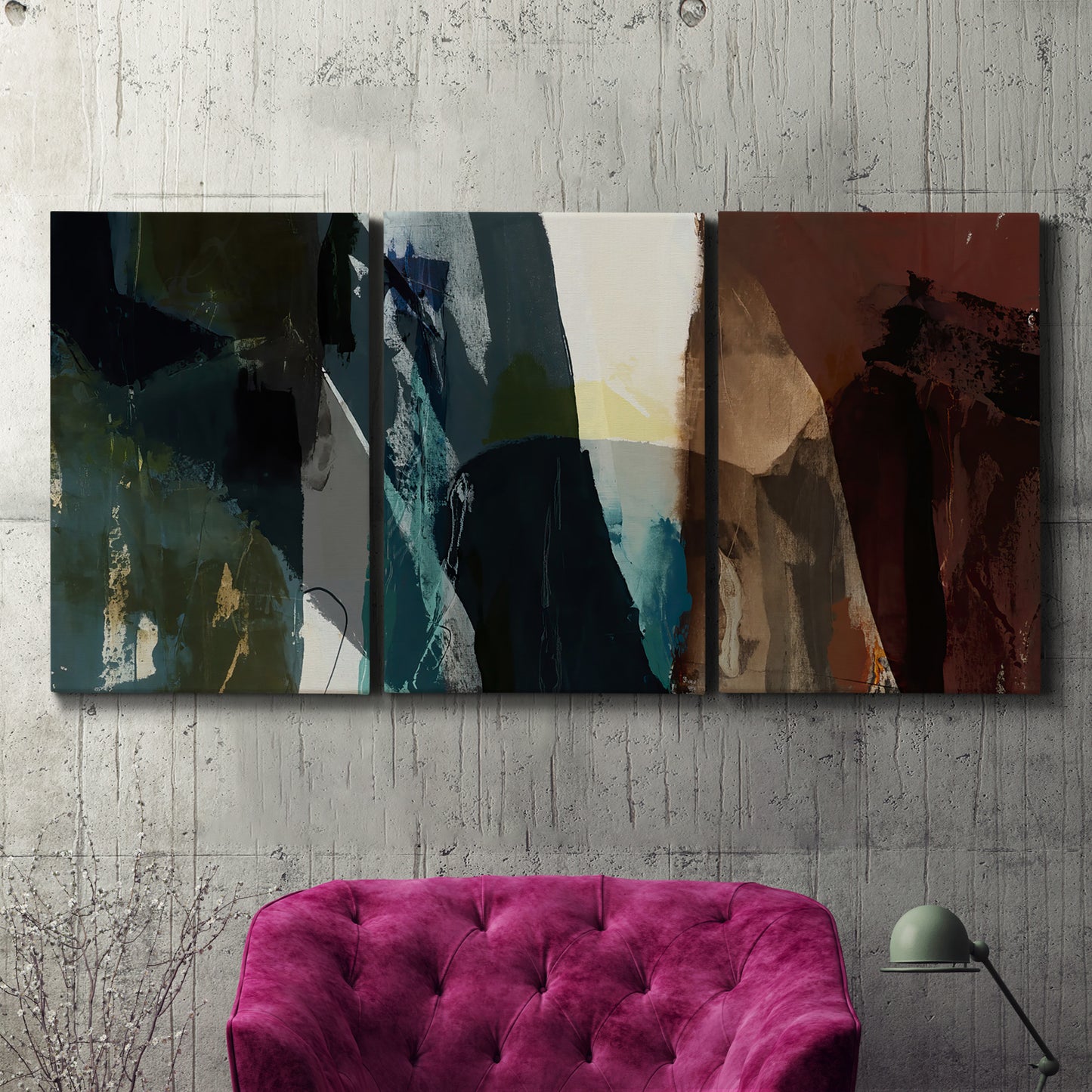 Three-panel canvas wall art featuring layered neutral abstract textures, displayed in a living room above a suede accent chair.