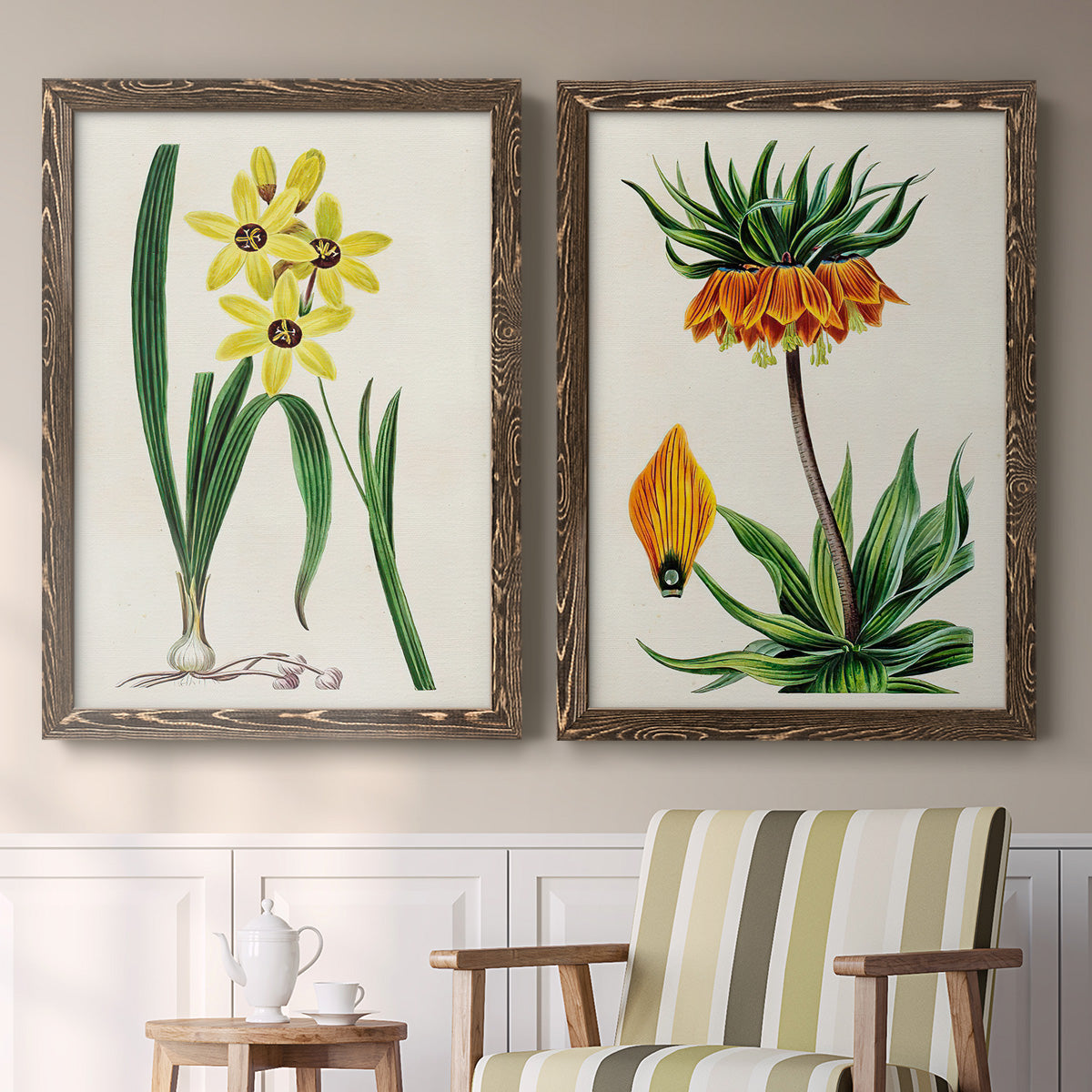 Set of two walnut barnwood framed canvas prints depicting two antique botanical plate illustrations featuring colorful flowering plant specimens above a sideboard in a cozy sitting room.