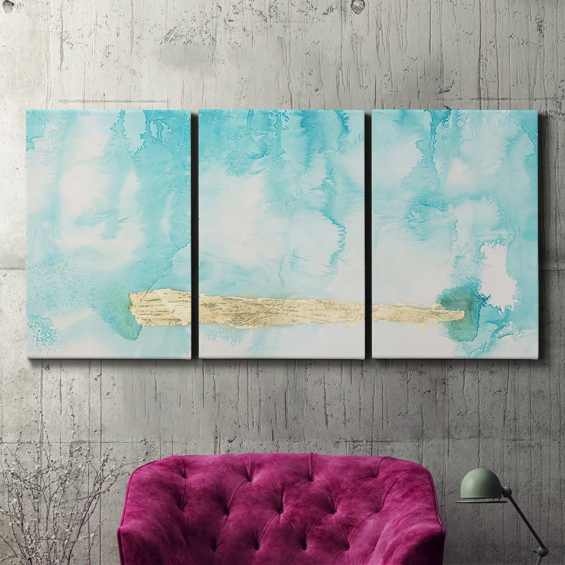 Three-panel canvas wall art featuring saturated abstract color fields, displayed in a living room above a suede accent chair.