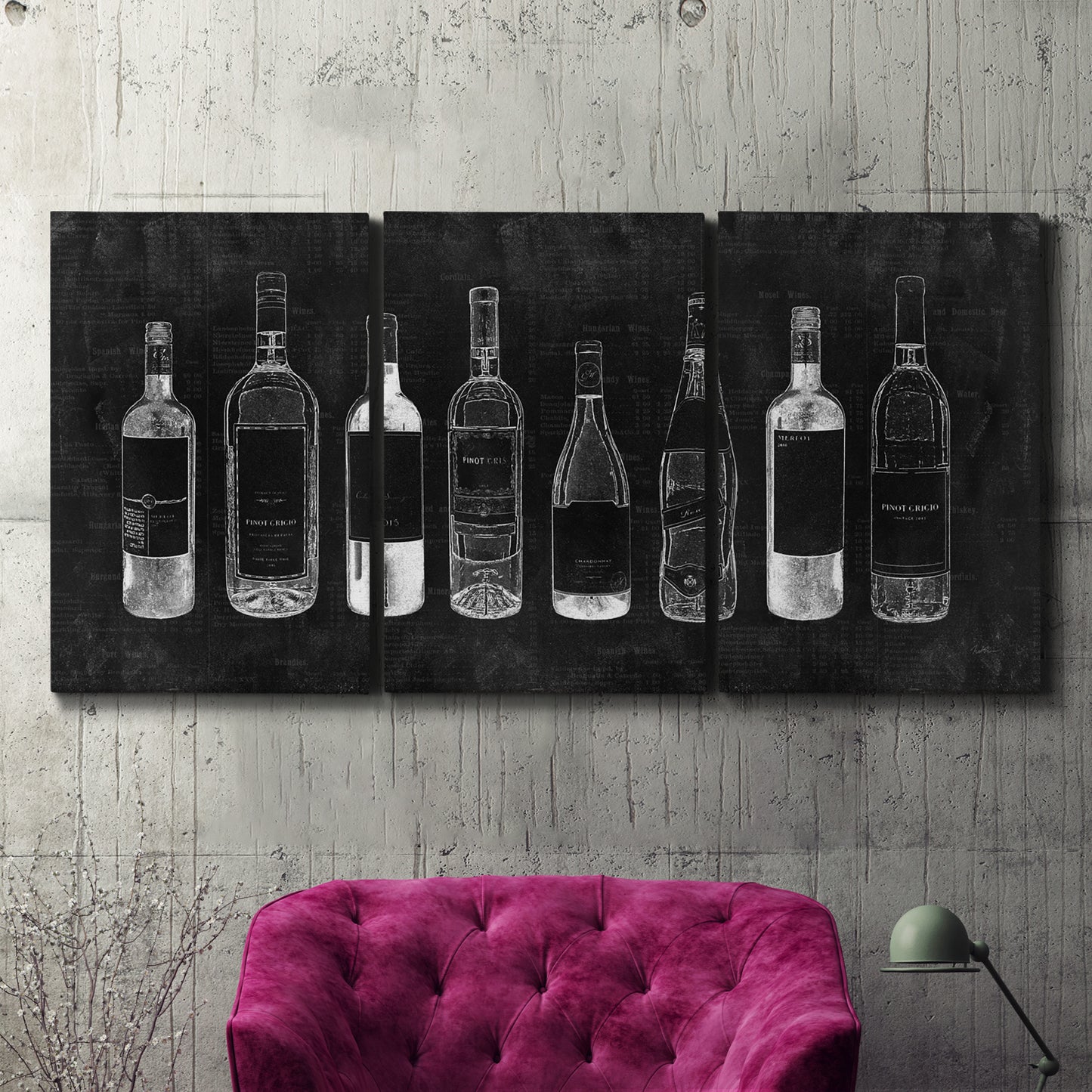 Three-panel canvas wall art featuring illustrated wine bottle cellar diagram, displayed in a living room above a suede accent chair.