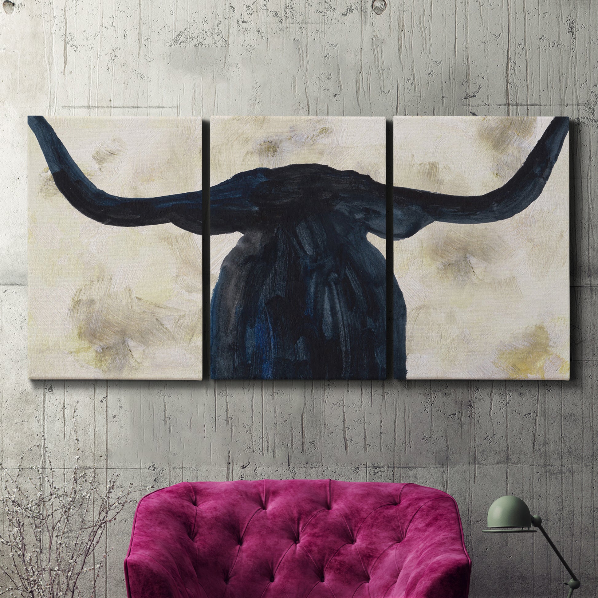 Three-panel canvas wall art featuring rustic animal portrait illustration, displayed in a living room above a suede accent chair.