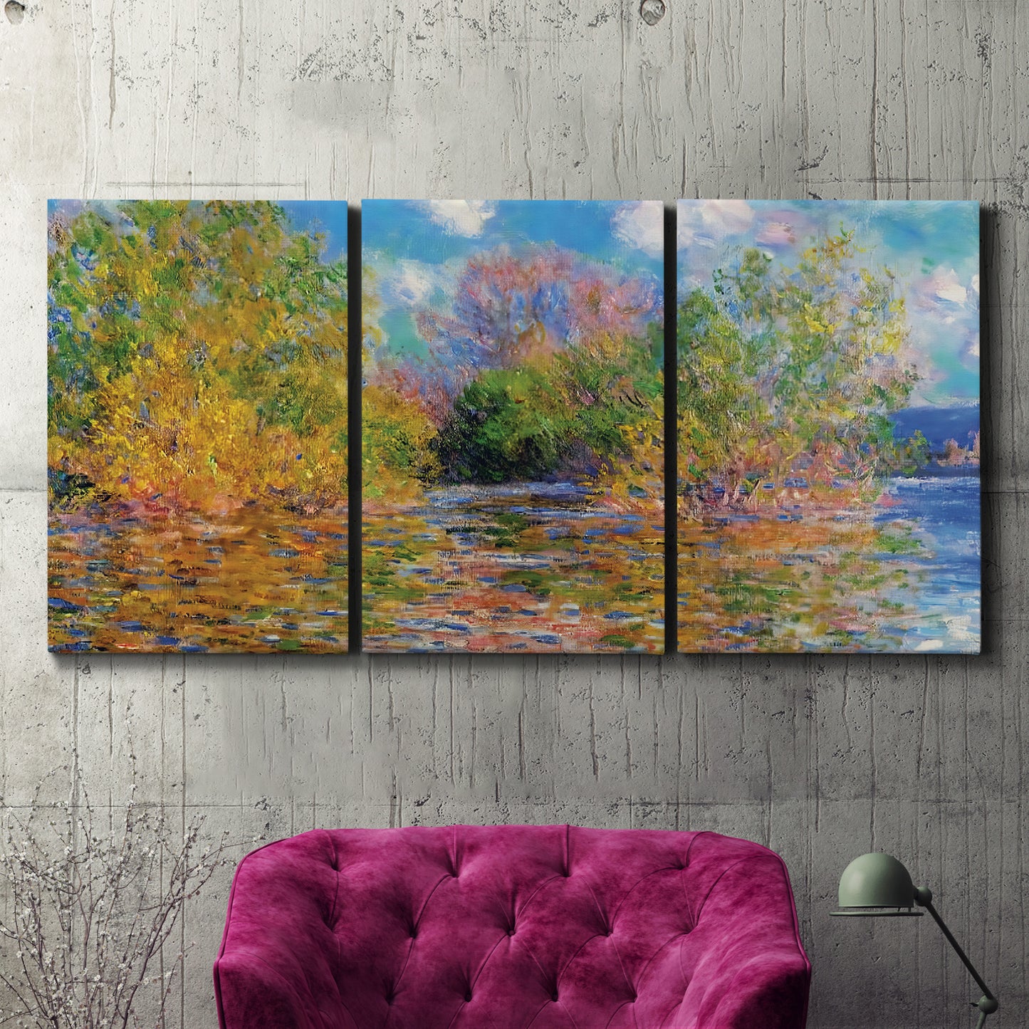 Three-panel canvas wall art featuring wide river landscape, displayed in a living room above a suede accent chair.