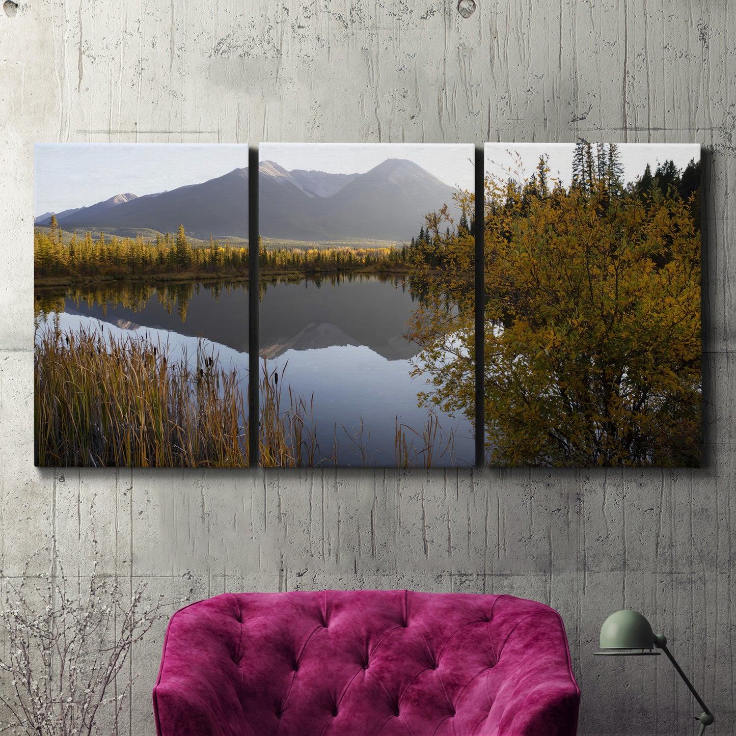 Three-panel canvas wall art featuring low light river photography, displayed in a living room above a suede accent chair.