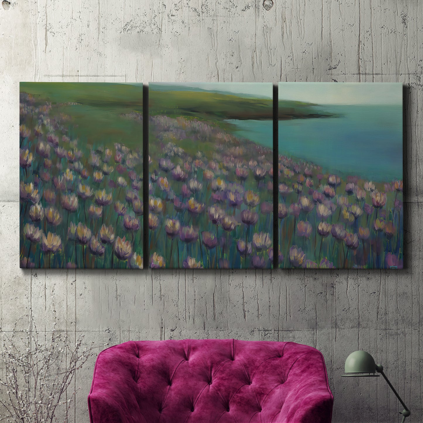 Three-panel canvas wall art featuring calm coastal landscape sanctuary, displayed in a living room above a suede accent chair.