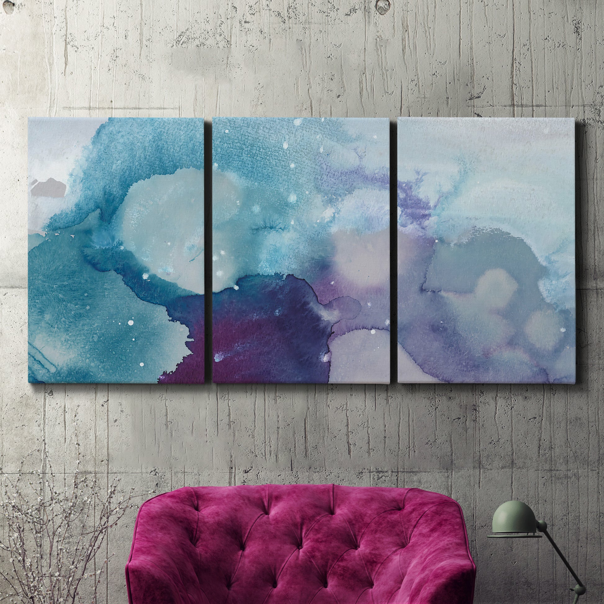 Three-panel canvas wall art featuring icy abstract crystalline forms, displayed in a living room above a suede accent chair.
