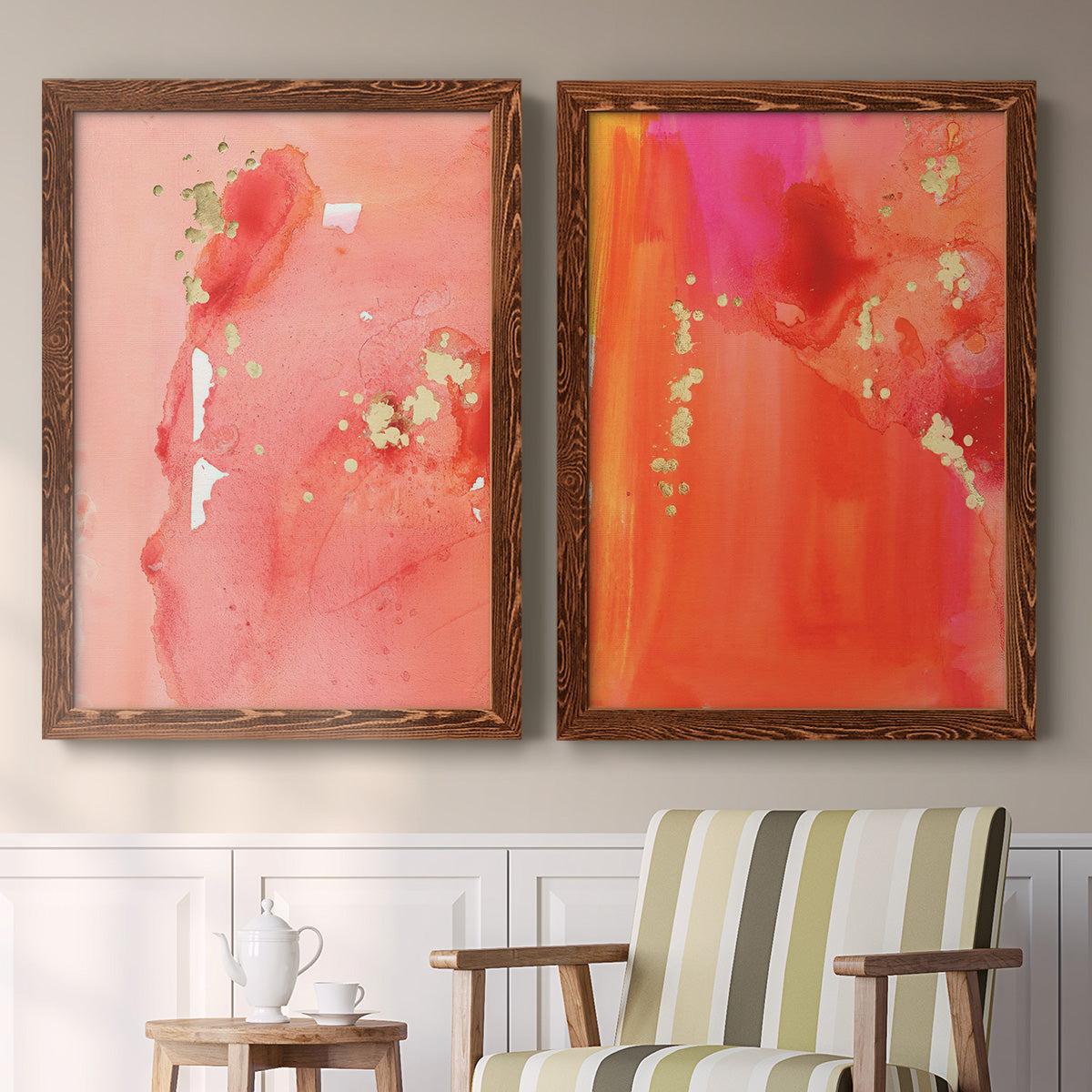 Set of two maple barnwood framed canvas prints depicting two glamorous fluid abstracts featuring luminous coral orange and pink color fields with gold flecks above a sideboard in a cozy sitting room.