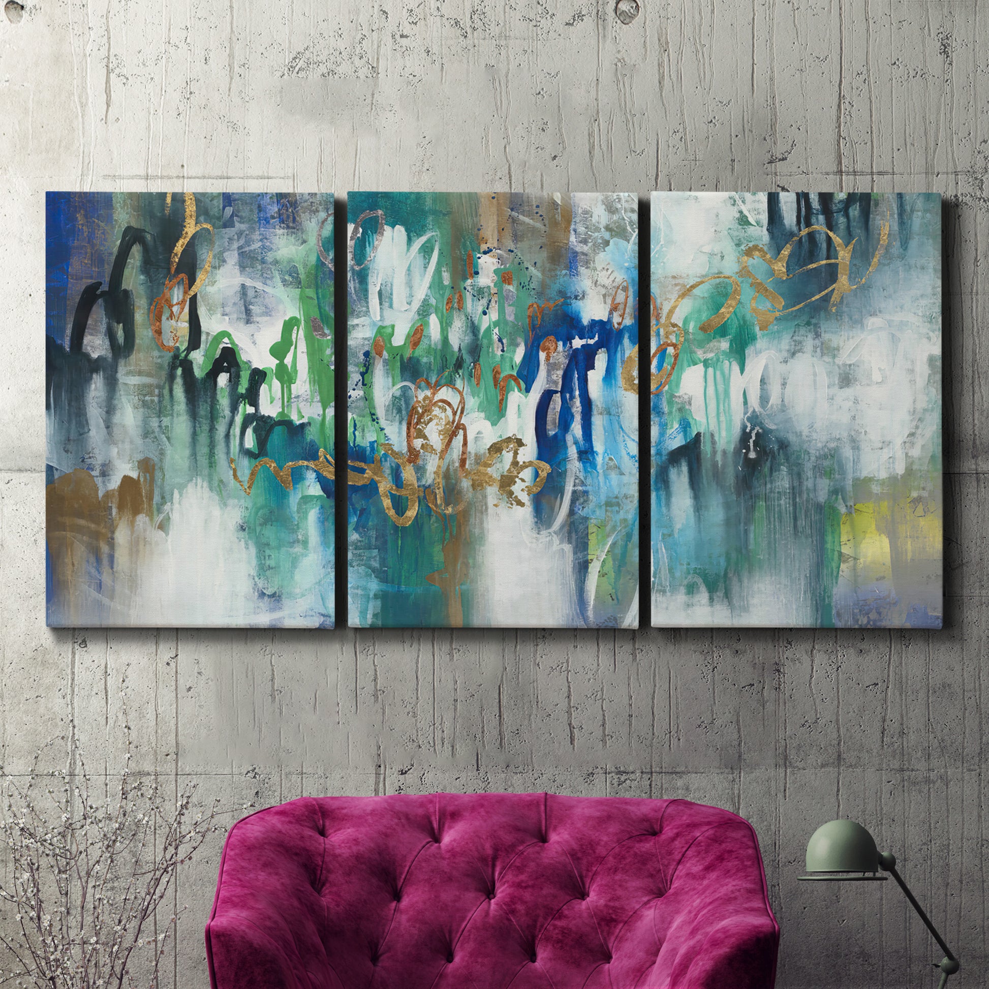 Three-panel canvas wall art featuring joyful abstract color harmony, displayed in a living room above a suede accent chair.