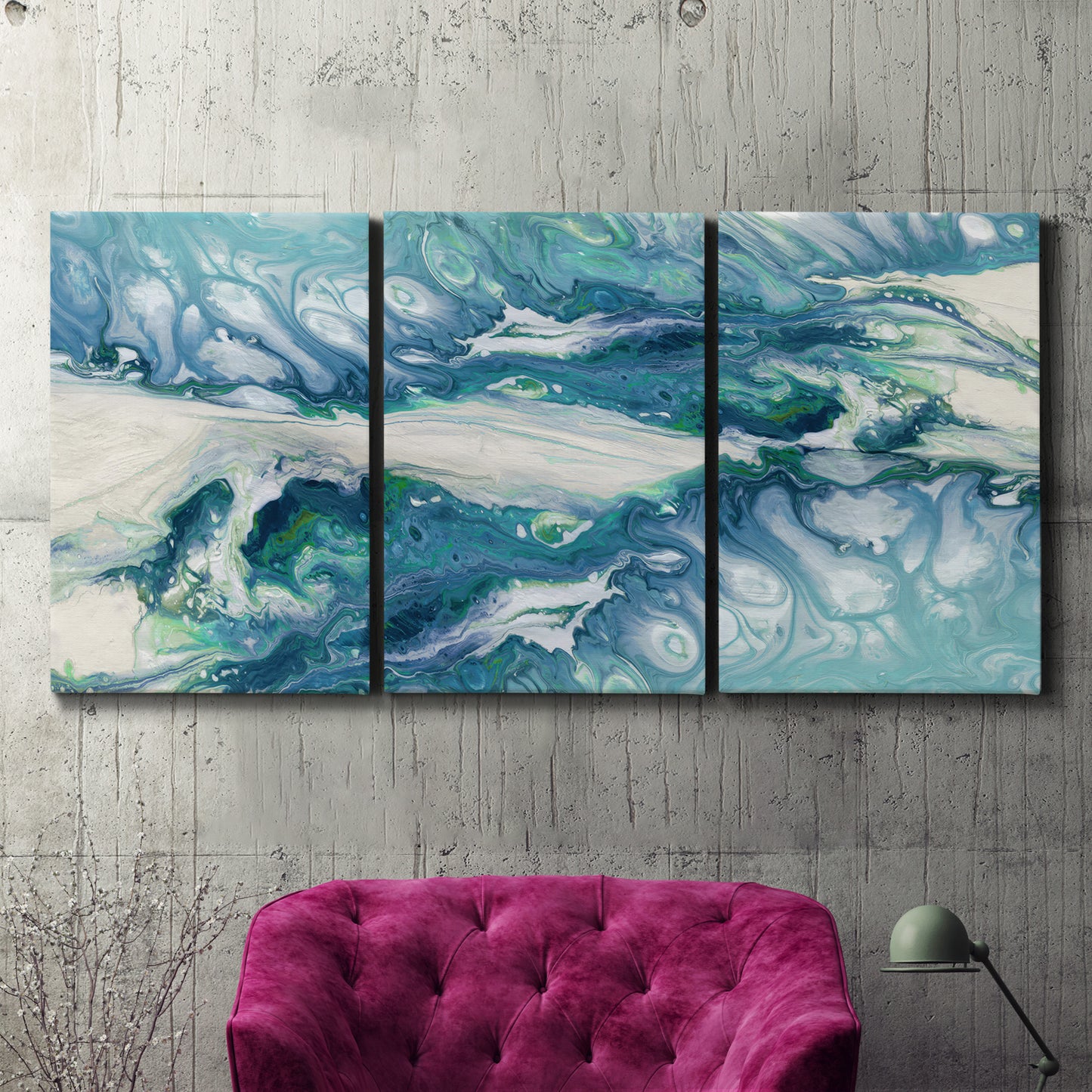 Three-panel canvas wall art featuring layered abstract marble textures, displayed in a living room above a suede accent chair.