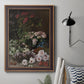 Early impressionist floral painting by Claude Monet in an ornate bronzed mahogany wood frame displayed in a neutral interior setting.