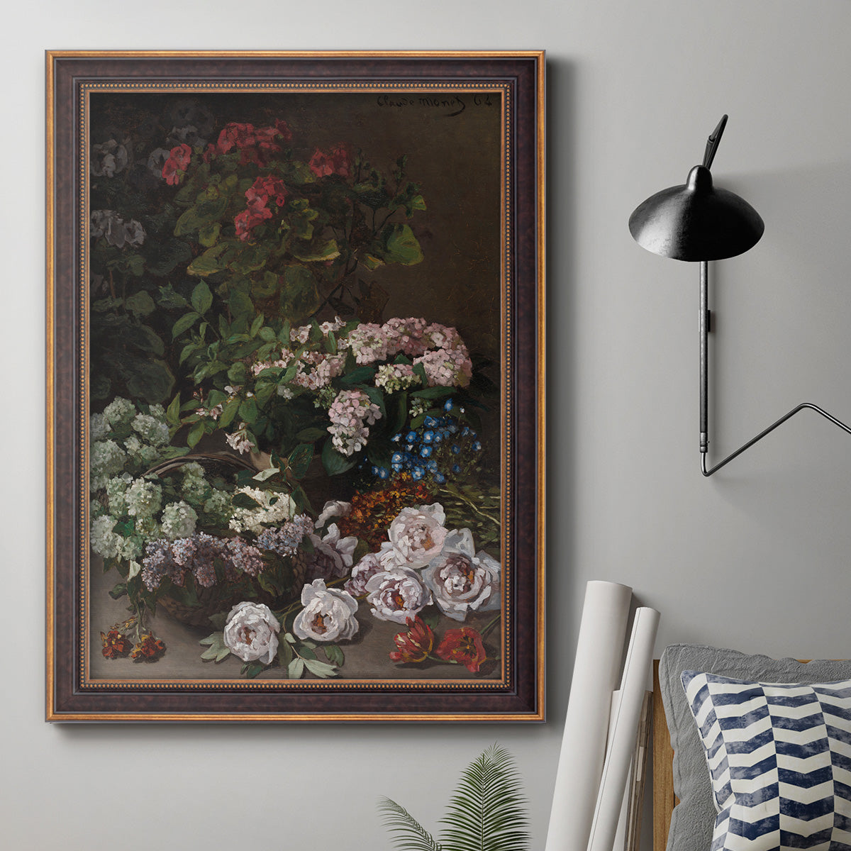 Early impressionist floral painting by Claude Monet in an ornate bronzed mahogany wood frame displayed in a neutral interior setting.