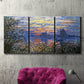 Three-panel canvas wall art featuring river sunset with reflections, displayed in a living room above a suede accent chair.
