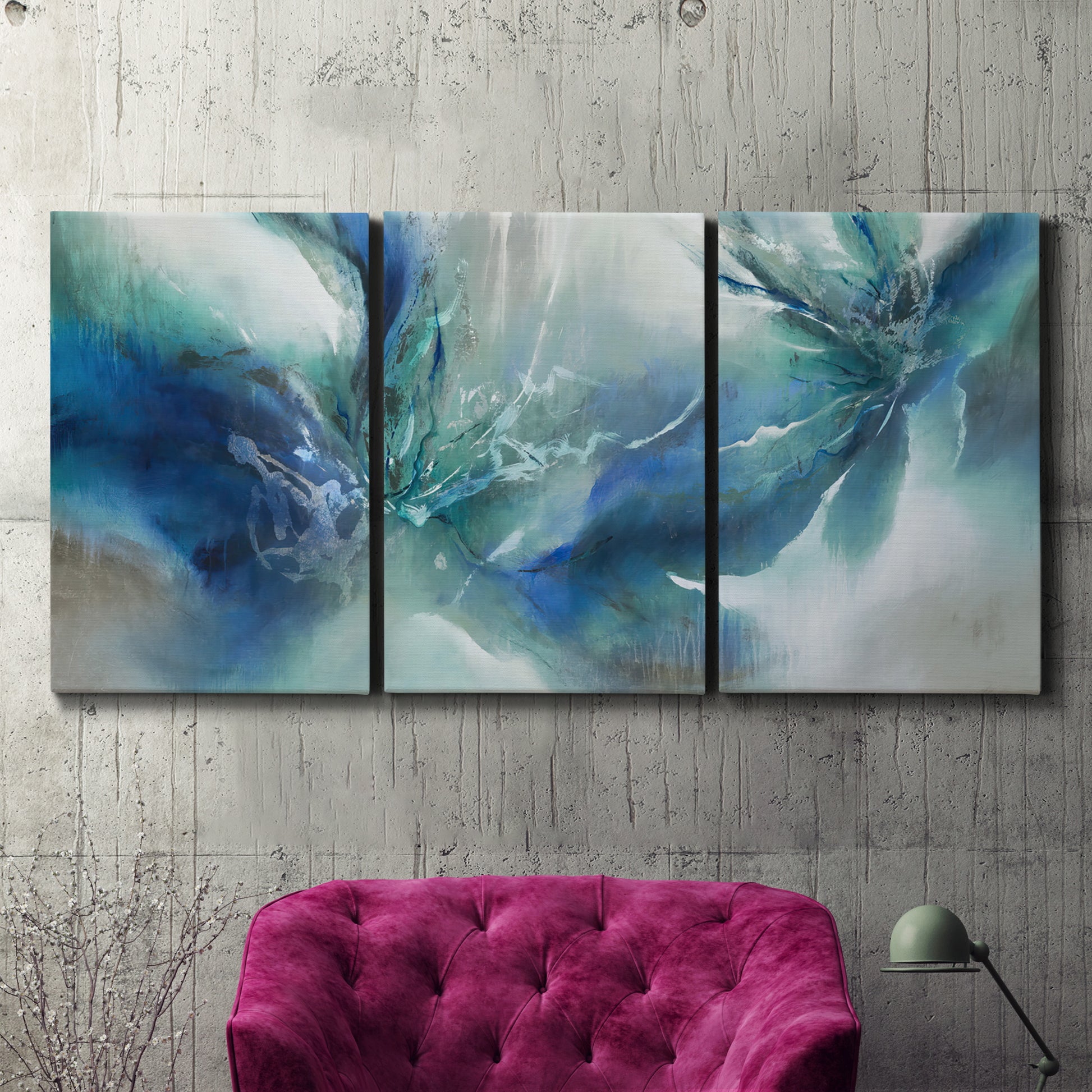 Three-panel canvas wall art featuring subtle abstract light flicker composition, displayed in a living room above a suede accent chair.