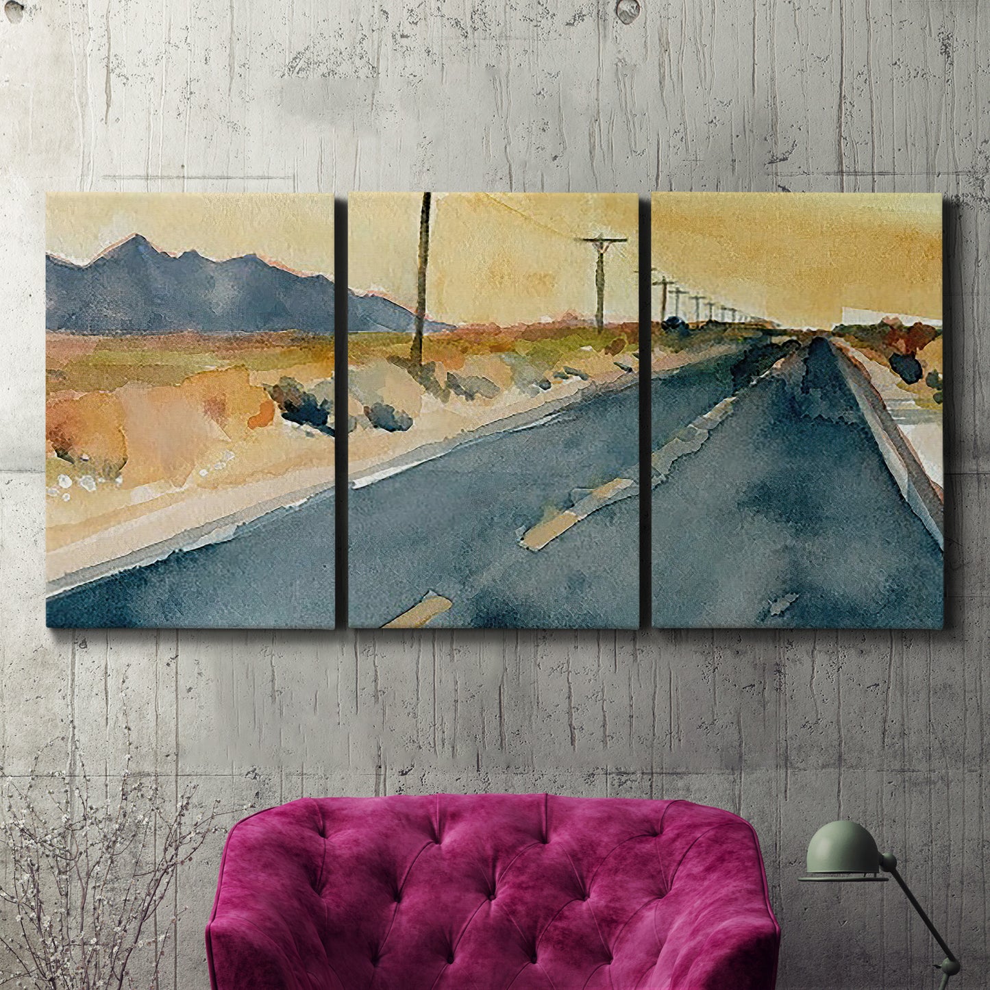 Three-panel canvas wall art featuring empty highway stretching through landscape, displayed in a living room above a suede accent chair.