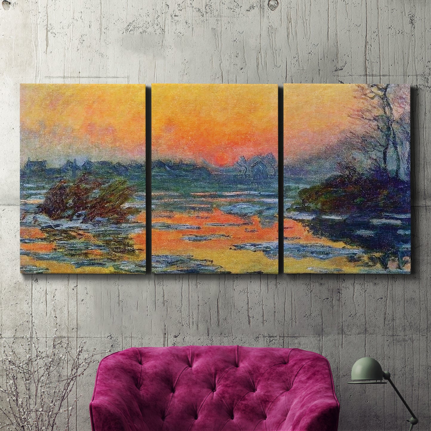 Three-panel canvas wall art featuring winter sunset over river, displayed in a living room above a suede accent chair.