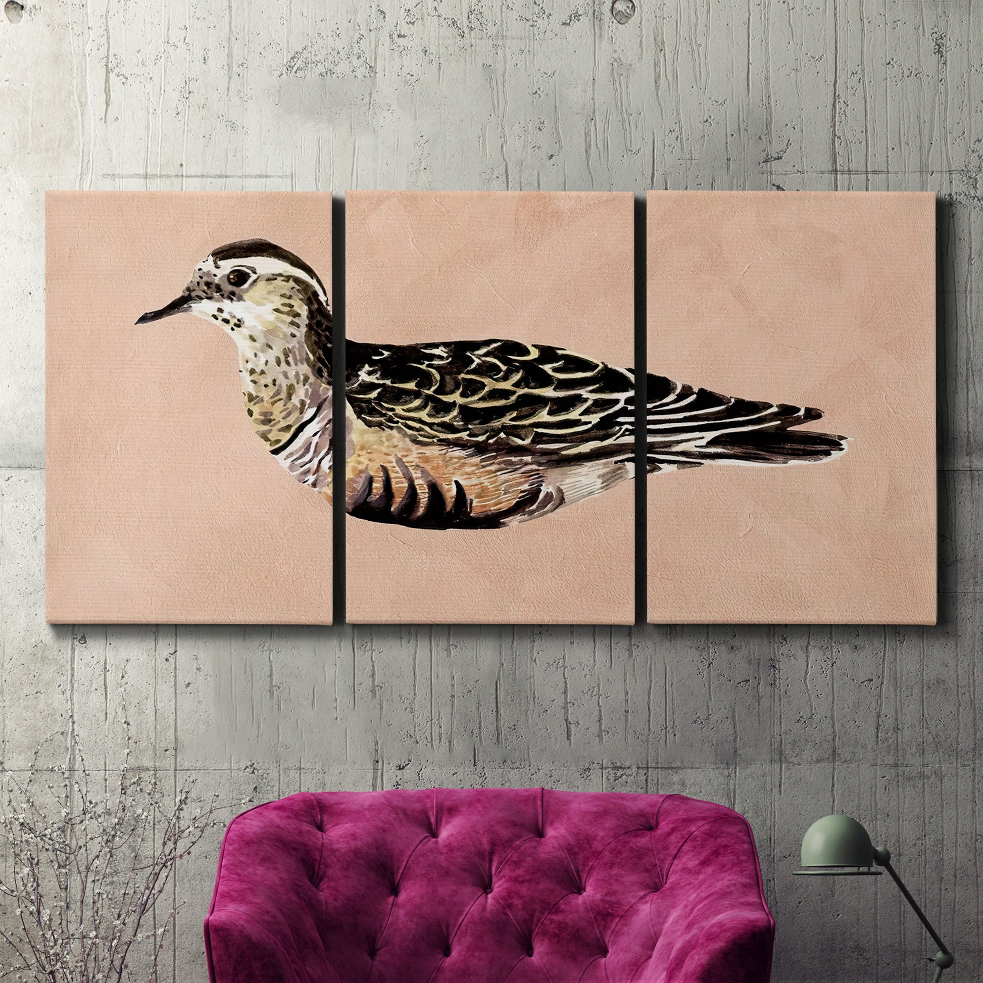 Three-panel canvas wall art featuring coastal bird illustration, displayed in a living room above a suede accent chair.