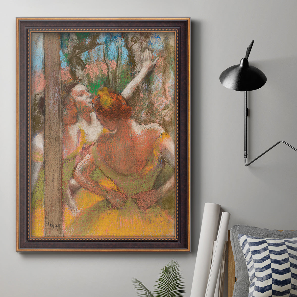Impressionist ballet dancer composition by Edgar Degas in an ornate bronzed mahogany wood frame displayed in a neutral interior setting.