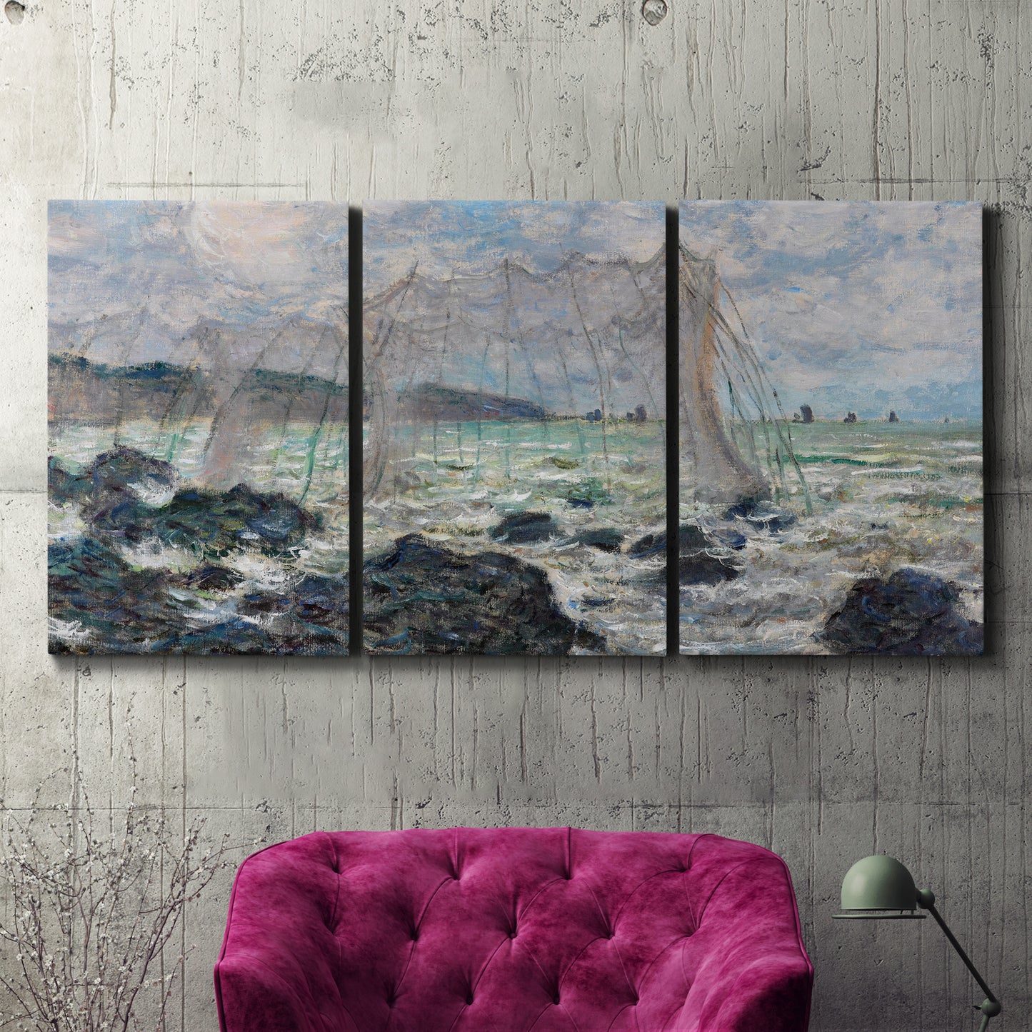 Three-panel canvas wall art featuring rough seas along rocky coast, displayed in a living room above a suede accent chair.