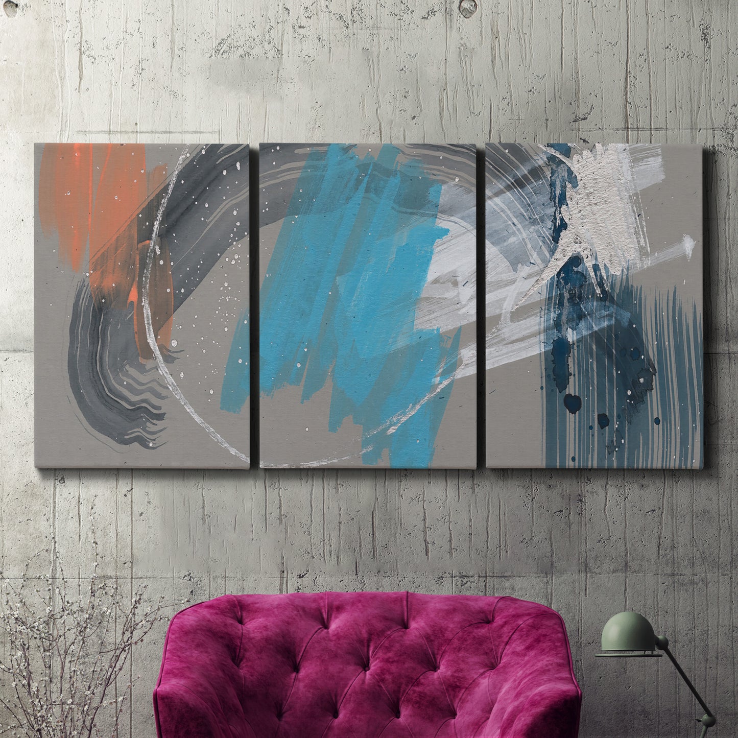 Three-panel canvas wall art featuring playful abstract mark making, displayed in a living room above a suede accent chair.