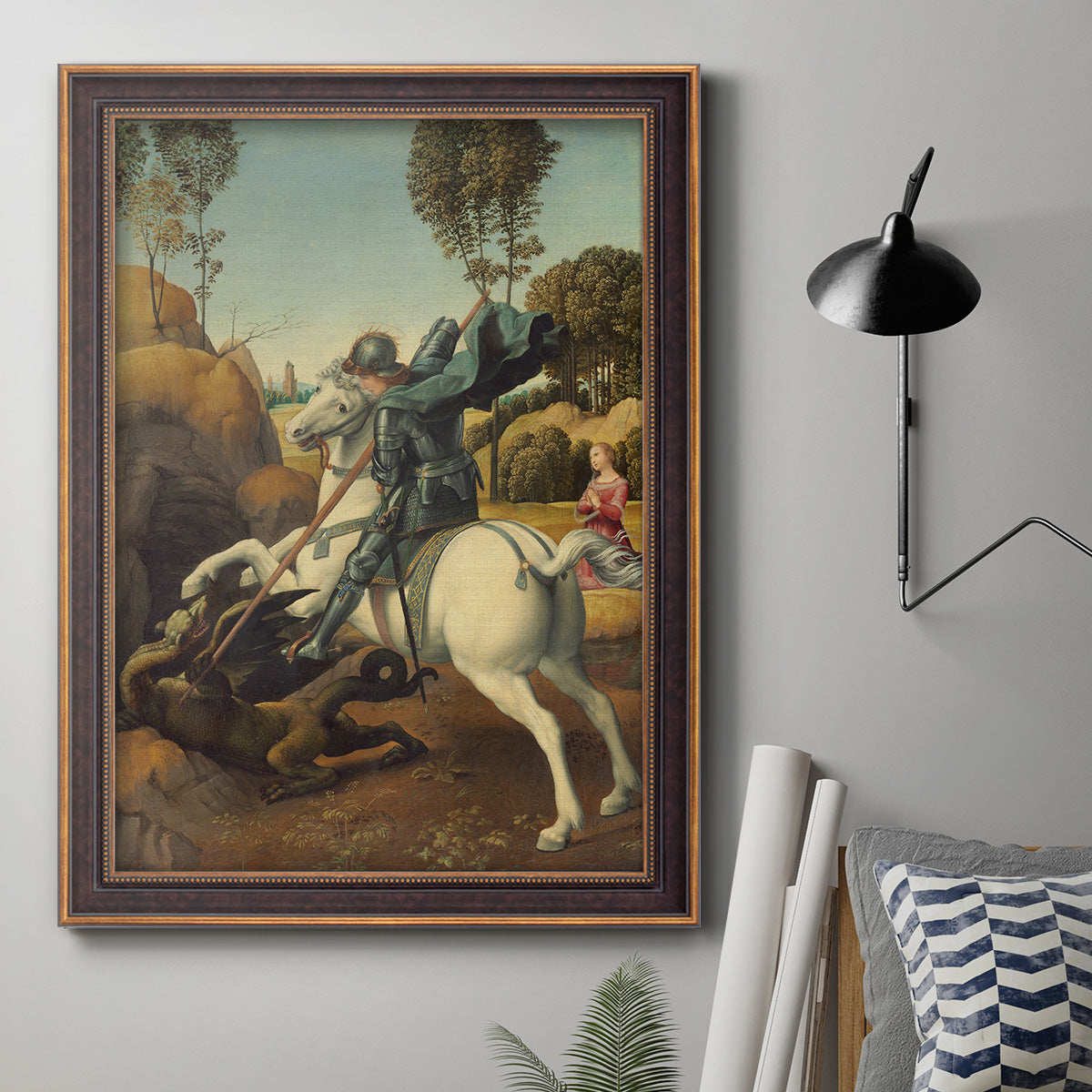Religious painting of Saint George slaying the dragon by Raphael in an ornate bronzed mahogany wood frame displayed in a neutral interior setting.