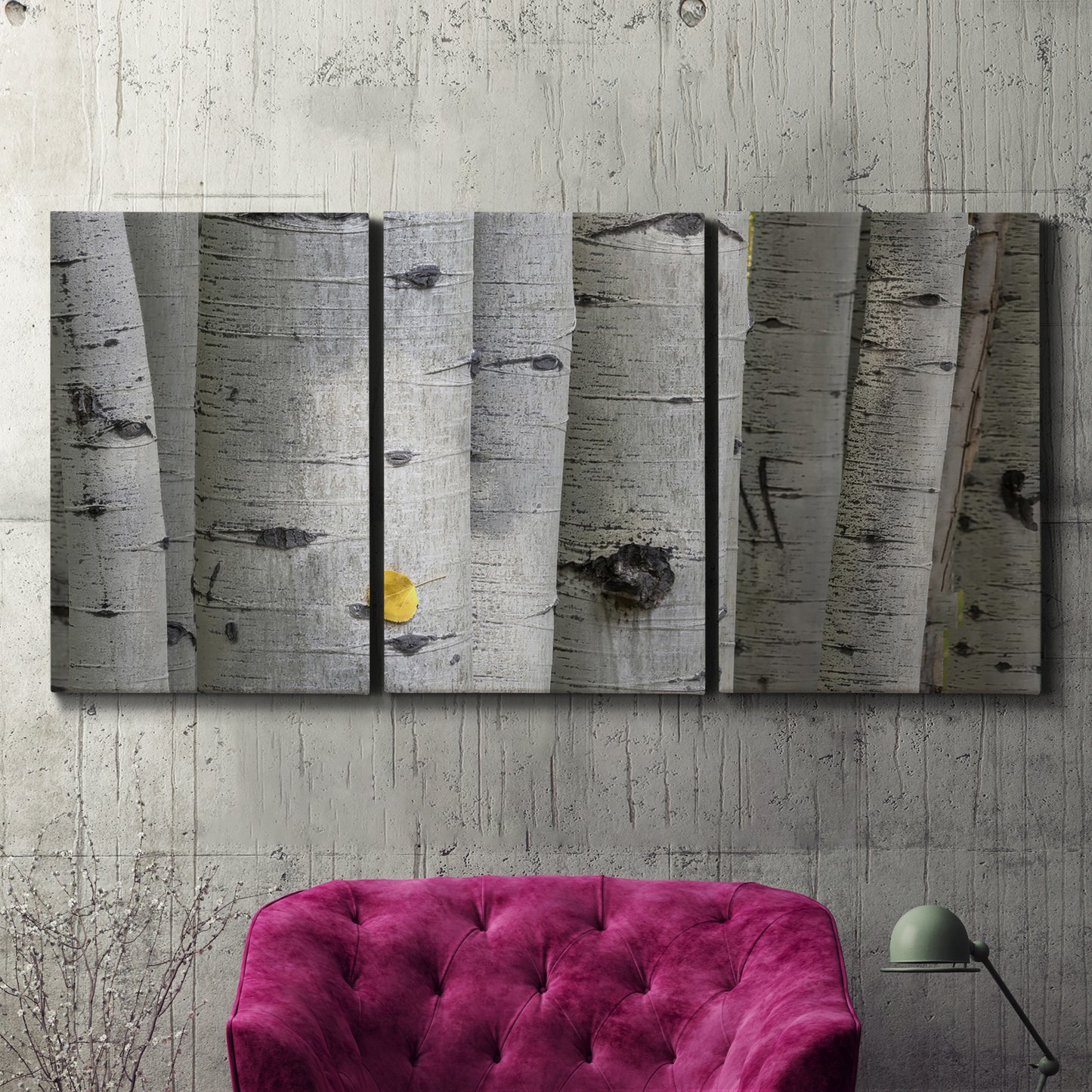 Three-panel canvas wall art featuring close up tree bark texture photograph, displayed in a living room above a suede accent chair.