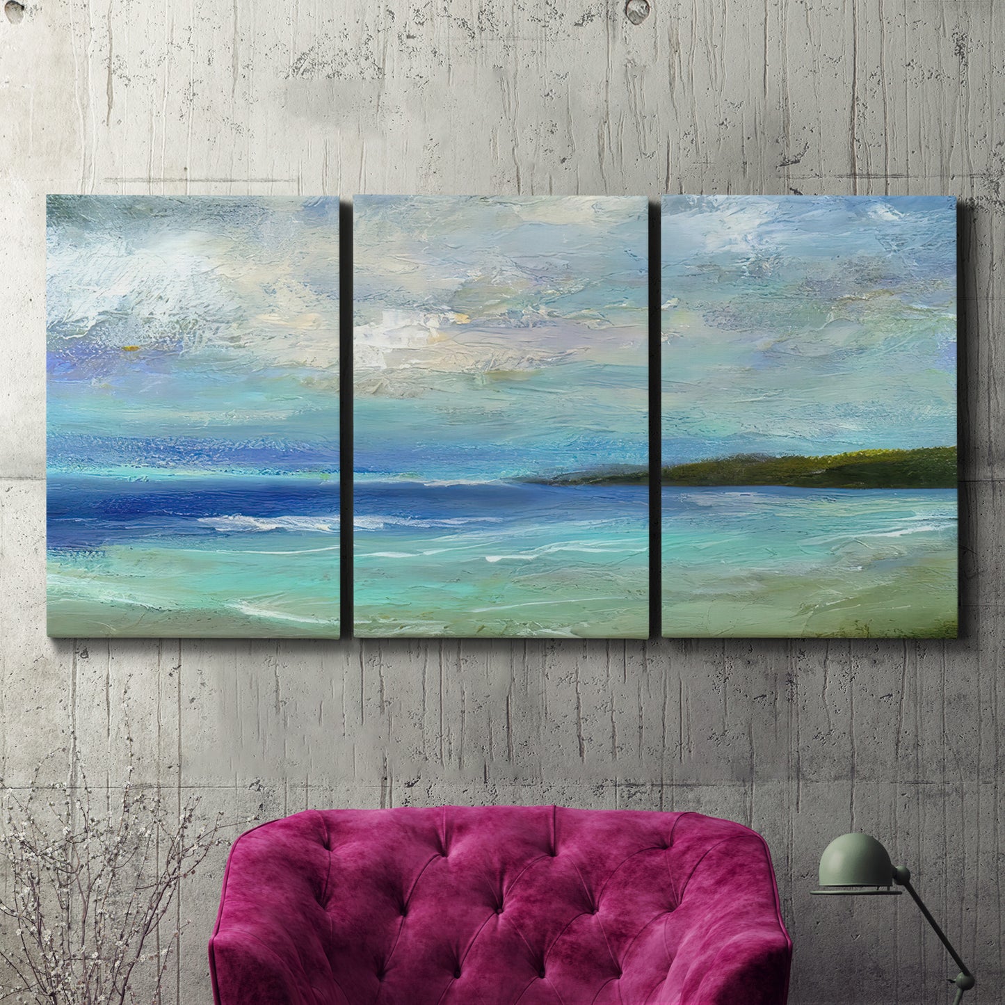 Three-panel canvas wall art featuring narrow island inlet waters, displayed in a living room above a suede accent chair.