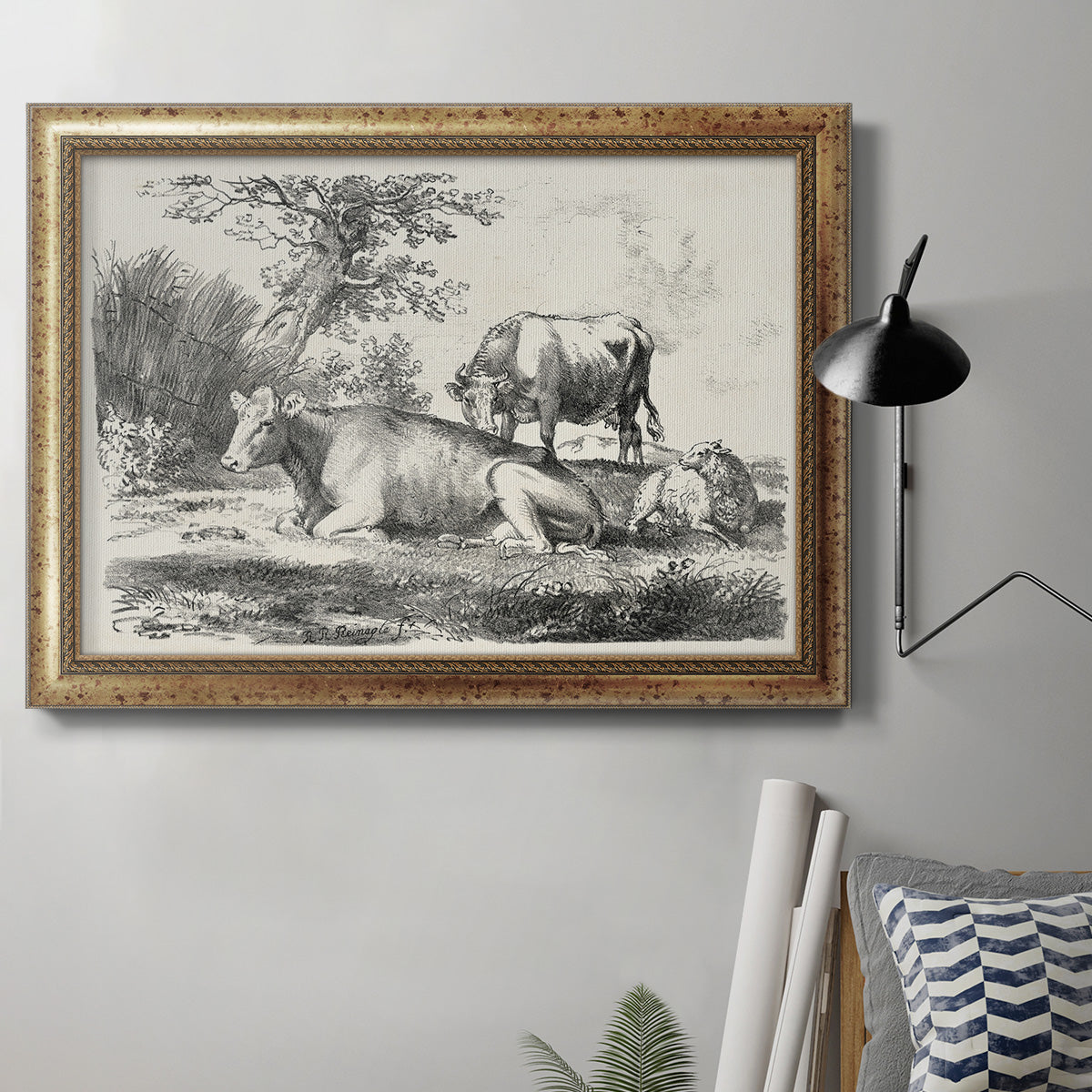 Classical pastoral landscape artwork by Nicolas Berchem in an ornate vintage gold frame displayed in a neutral interior setting.