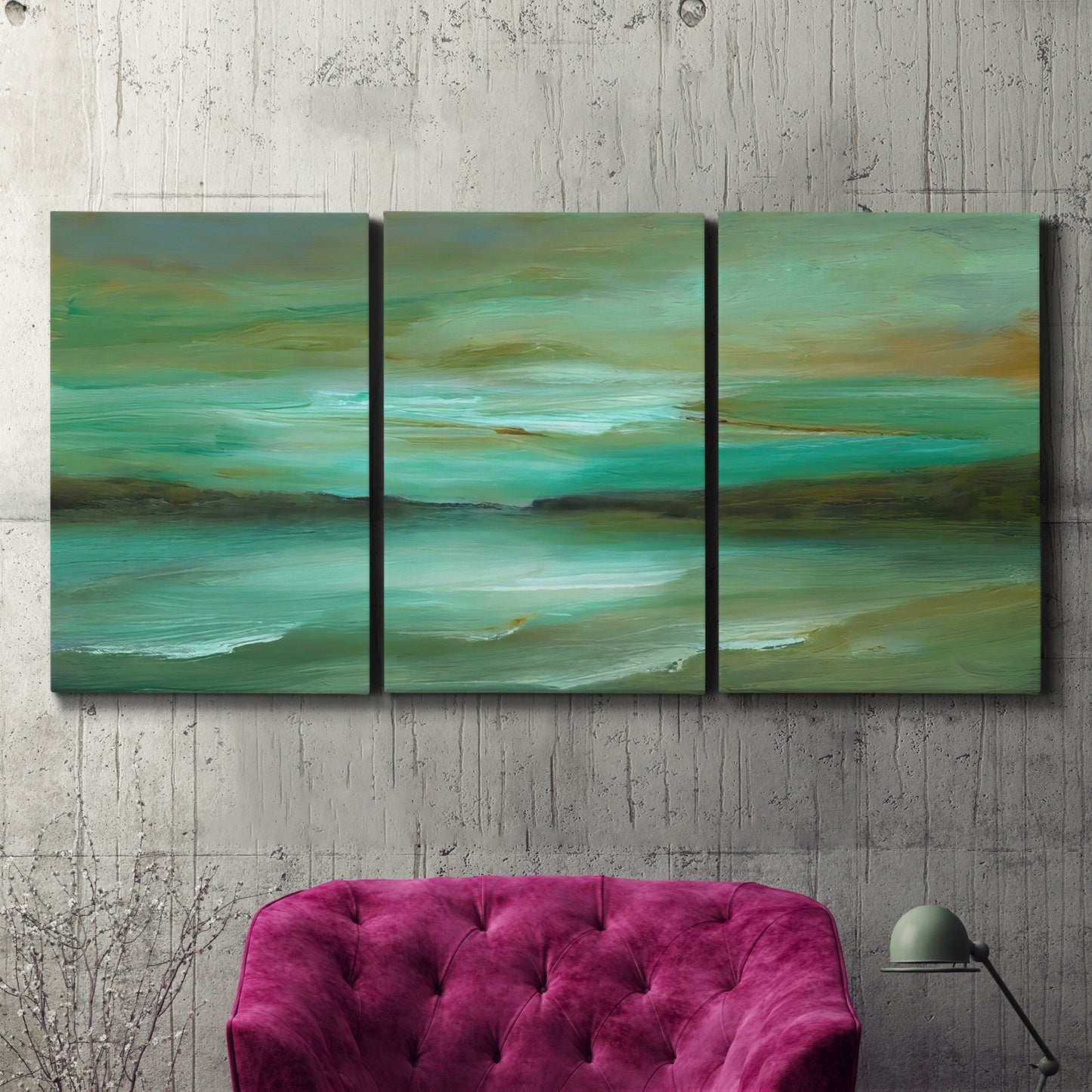 Three-panel canvas wall art featuring hidden coastal cove landscape, displayed in a living room above a suede accent chair.