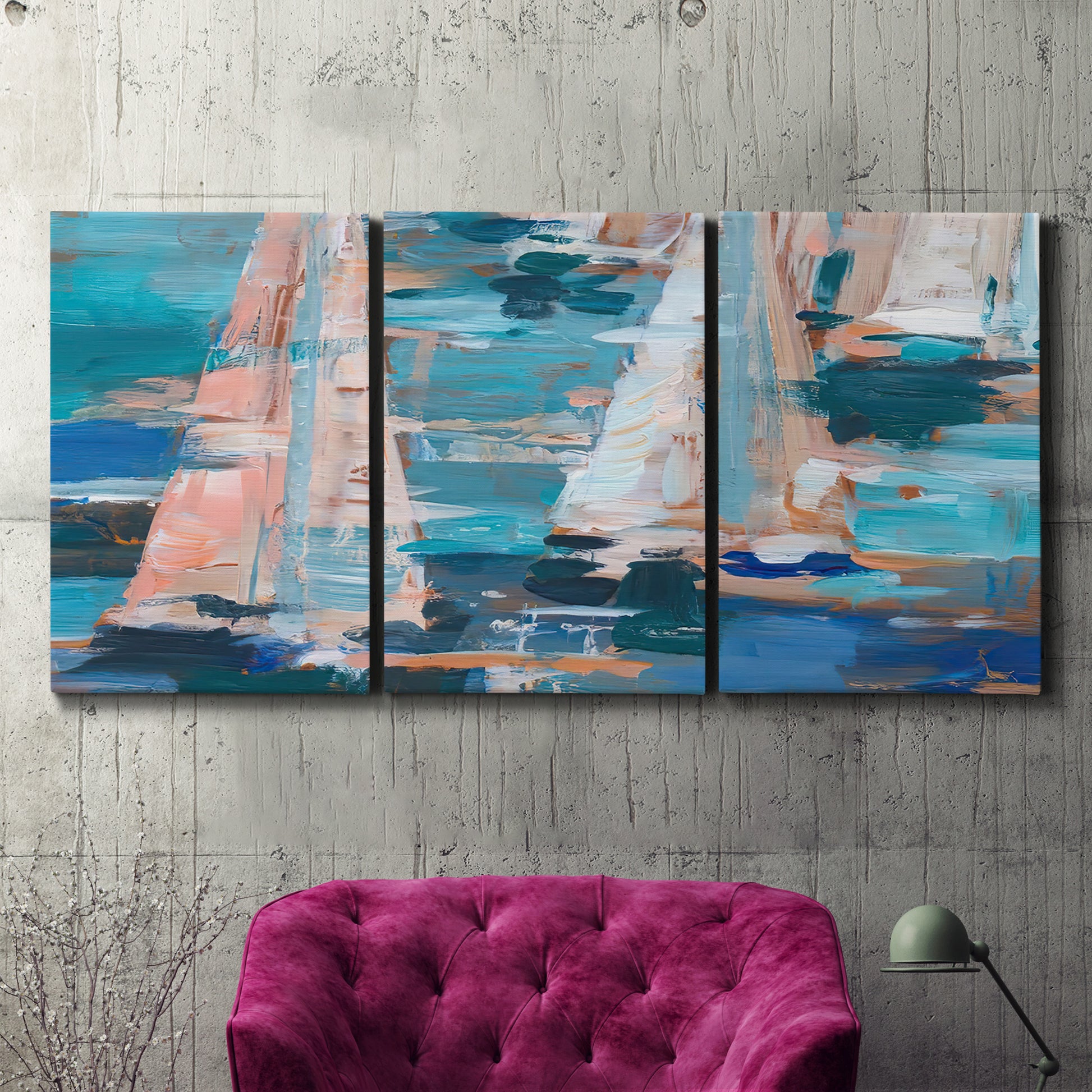Three-panel canvas wall art featuring graphic pop style sailboats, displayed in a living room above a suede accent chair.