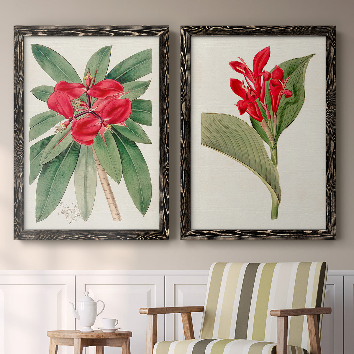 Set of two black barnwood framed canvas prints depicting two antique botanical plate illustrations featuring vivid tropical flowering plants above a sideboard in a cozy sitting room.