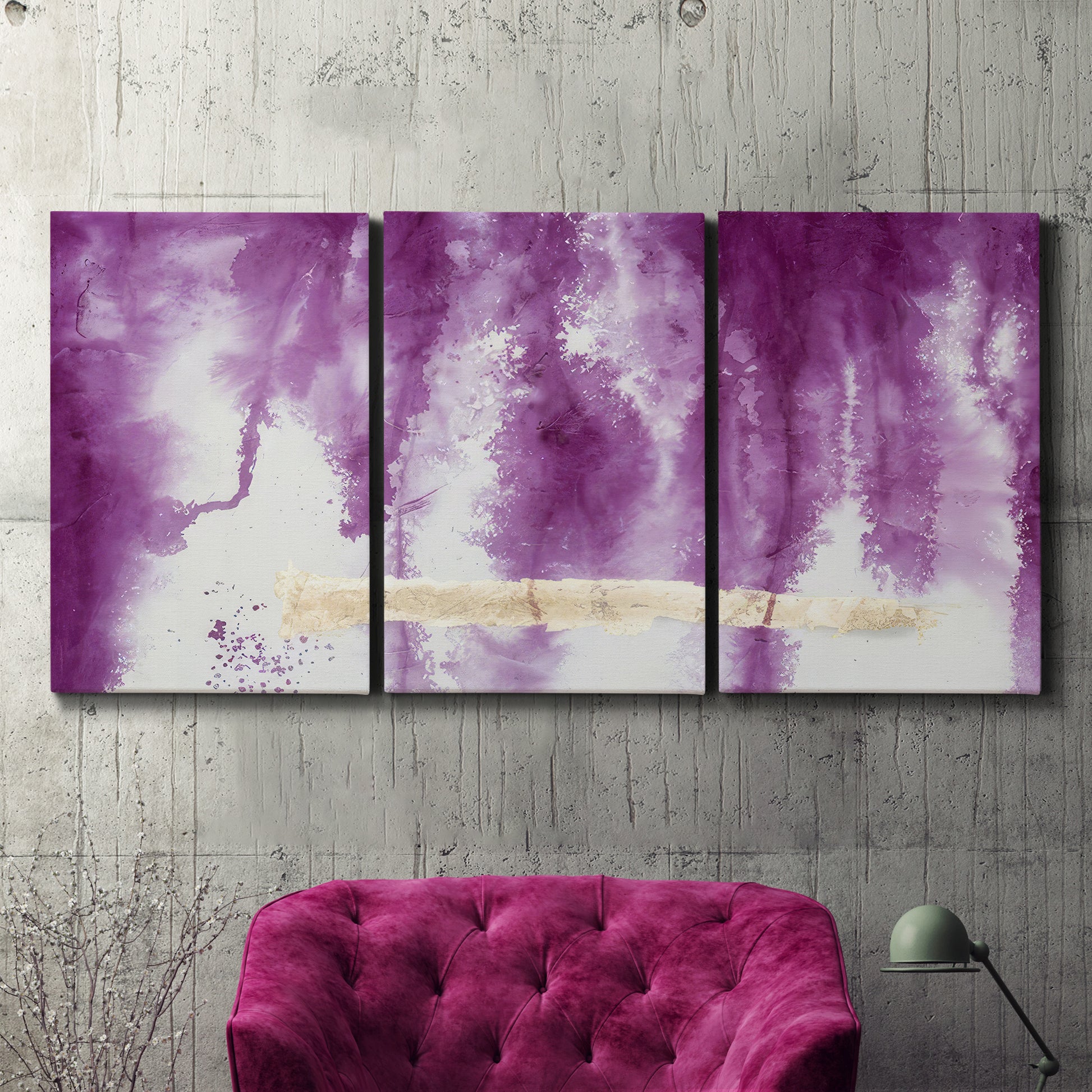 Three-panel canvas wall art featuring saturated abstract color fields, displayed in a living room above a suede accent chair.