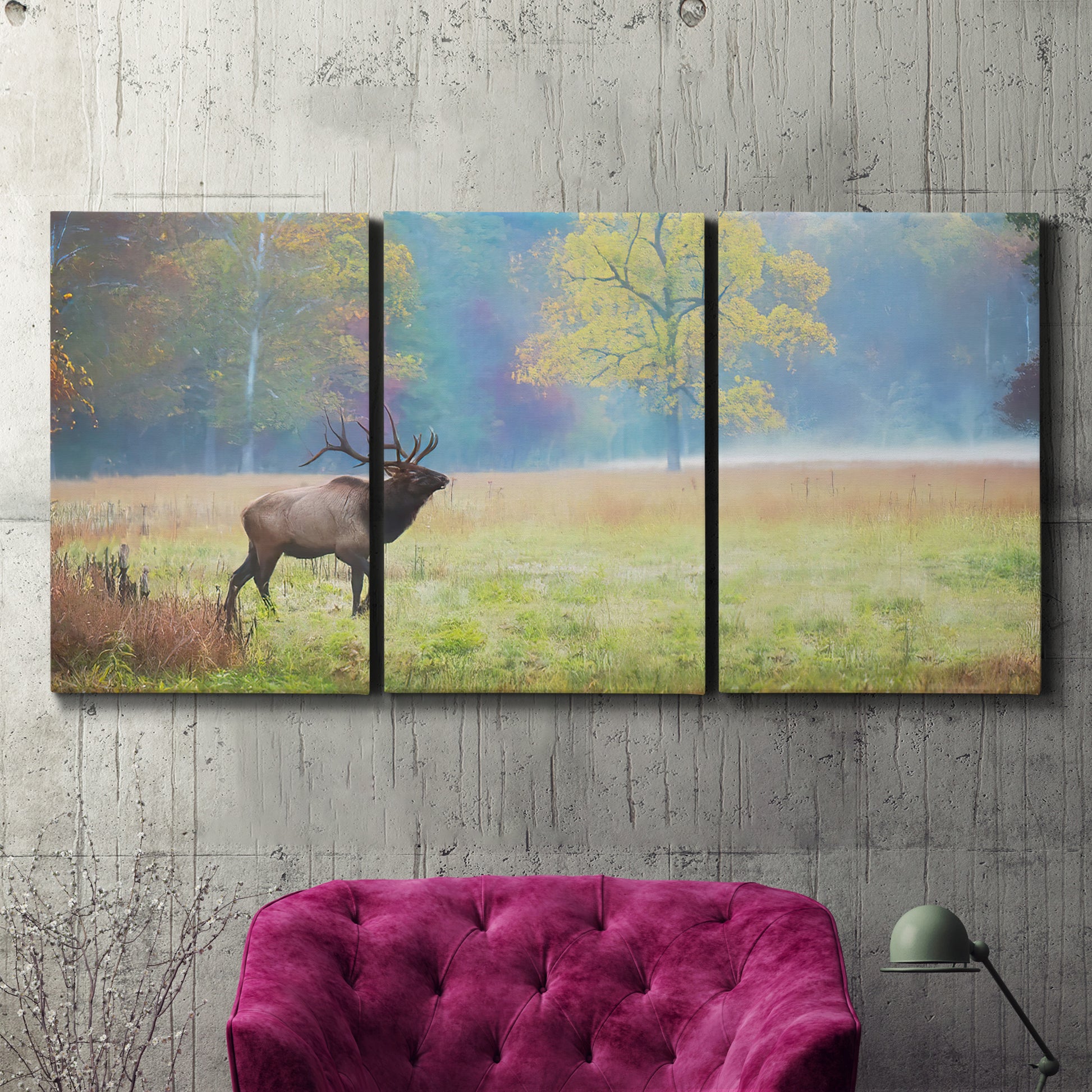 Three-panel canvas wall art featuring resting animals in open field, displayed in a living room above a suede accent chair.