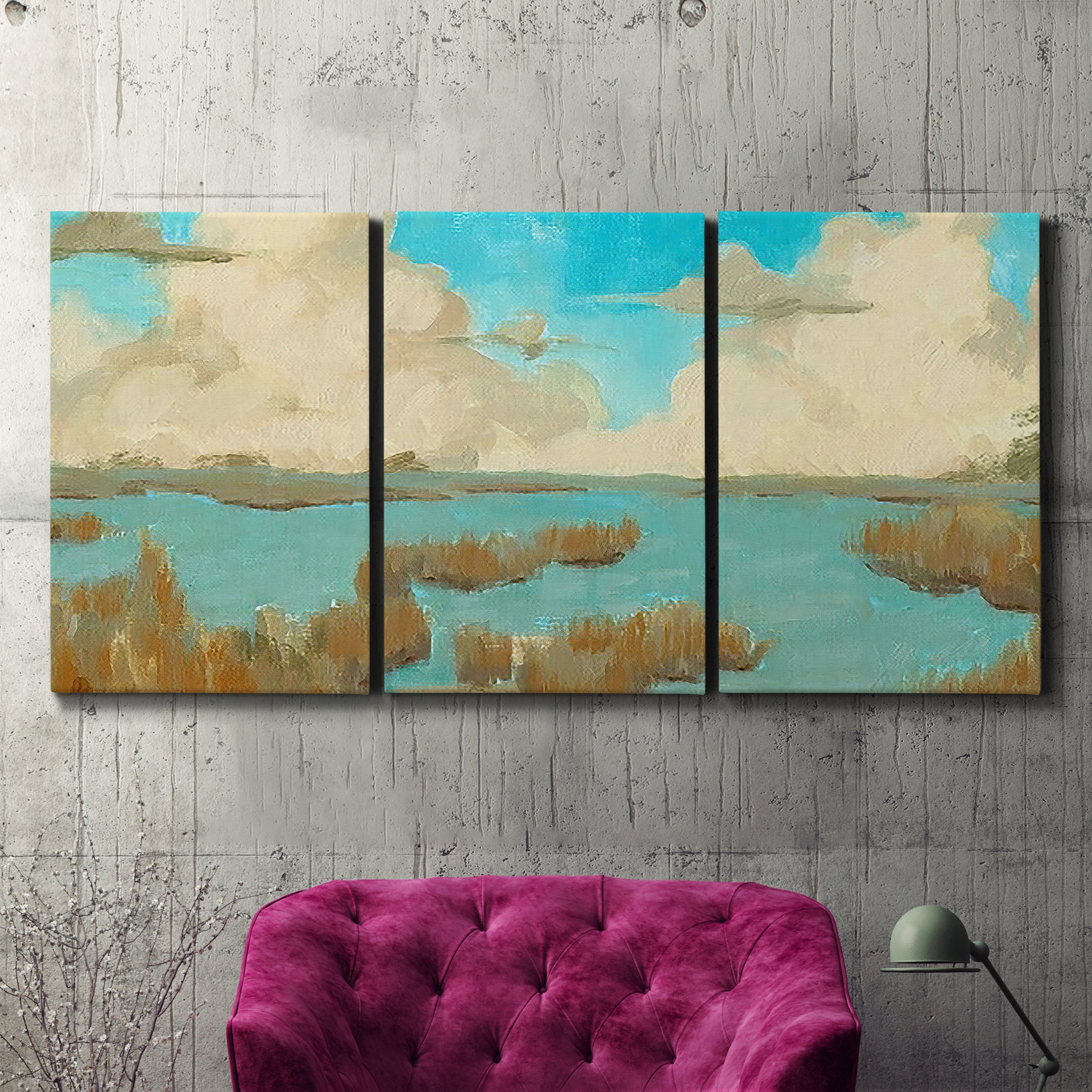Three-panel canvas wall art featuring abstract pond scene with reflections, displayed in a living room above a suede accent chair.