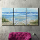 Three-panel canvas wall art featuring peaceful coastal landscape escape, displayed in a living room above a suede accent chair.