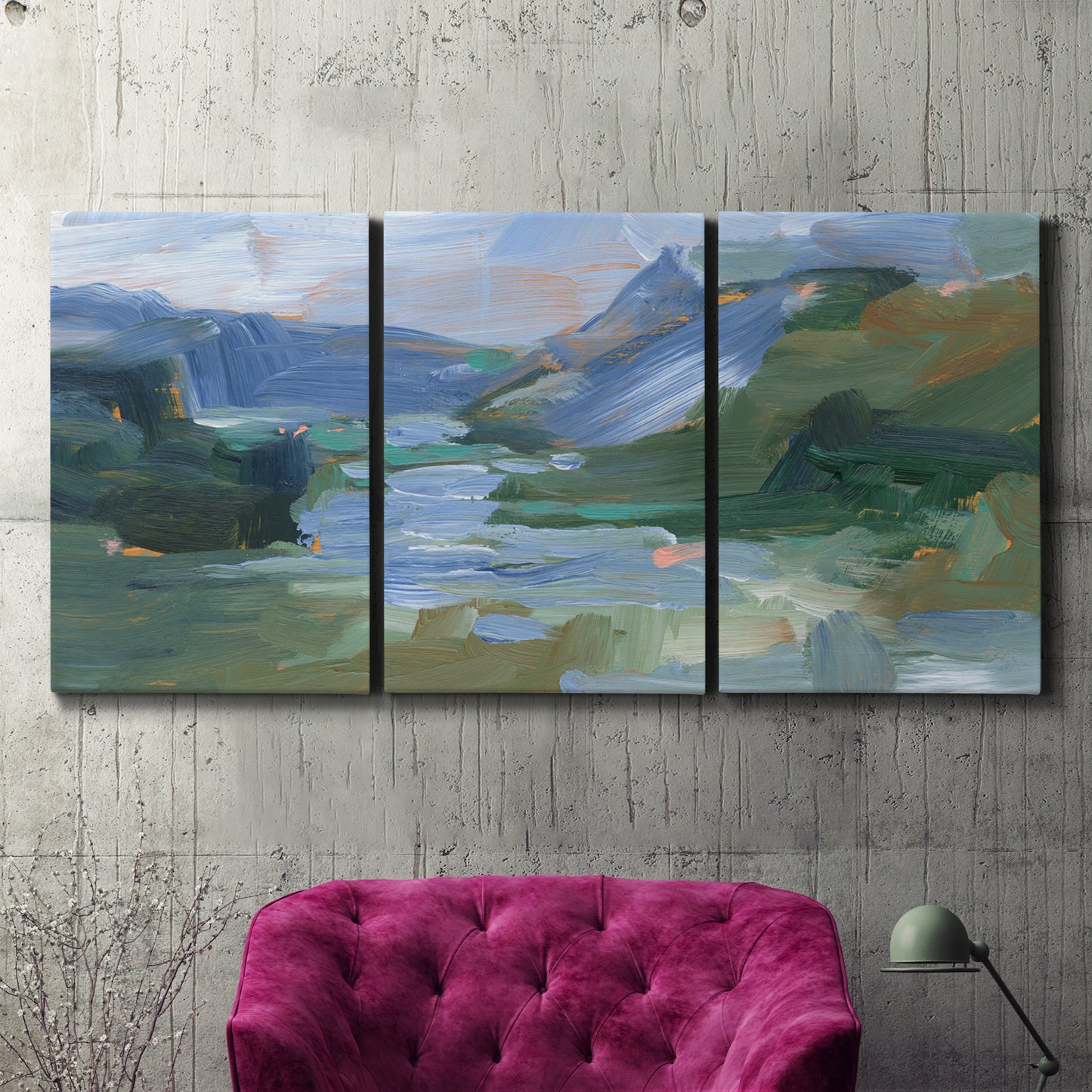 Three-panel canvas wall art featuring abstract landscape composition study, displayed in a living room above a suede accent chair.