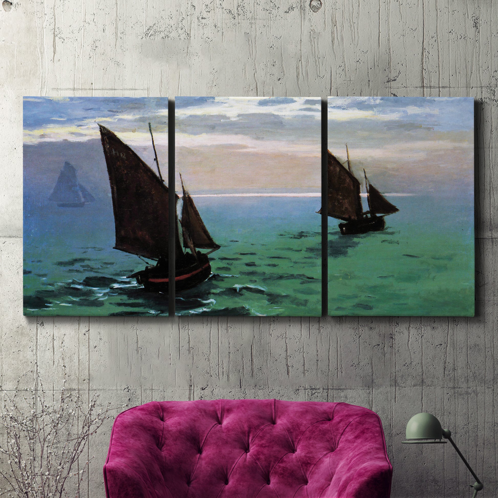 Three-panel canvas wall art featuring fishing boats moving through open sea, displayed in a living room above a suede accent chair.