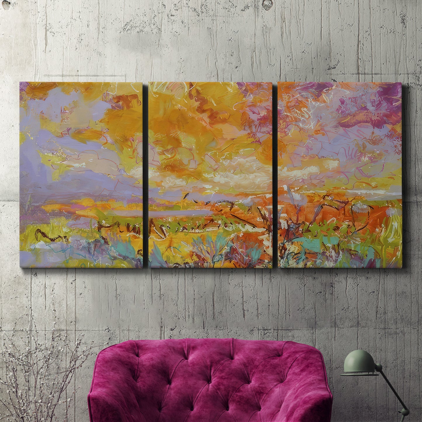 Three-panel canvas wall art featuring abstract meadow inspired color fields, displayed in a living room above a suede accent chair.