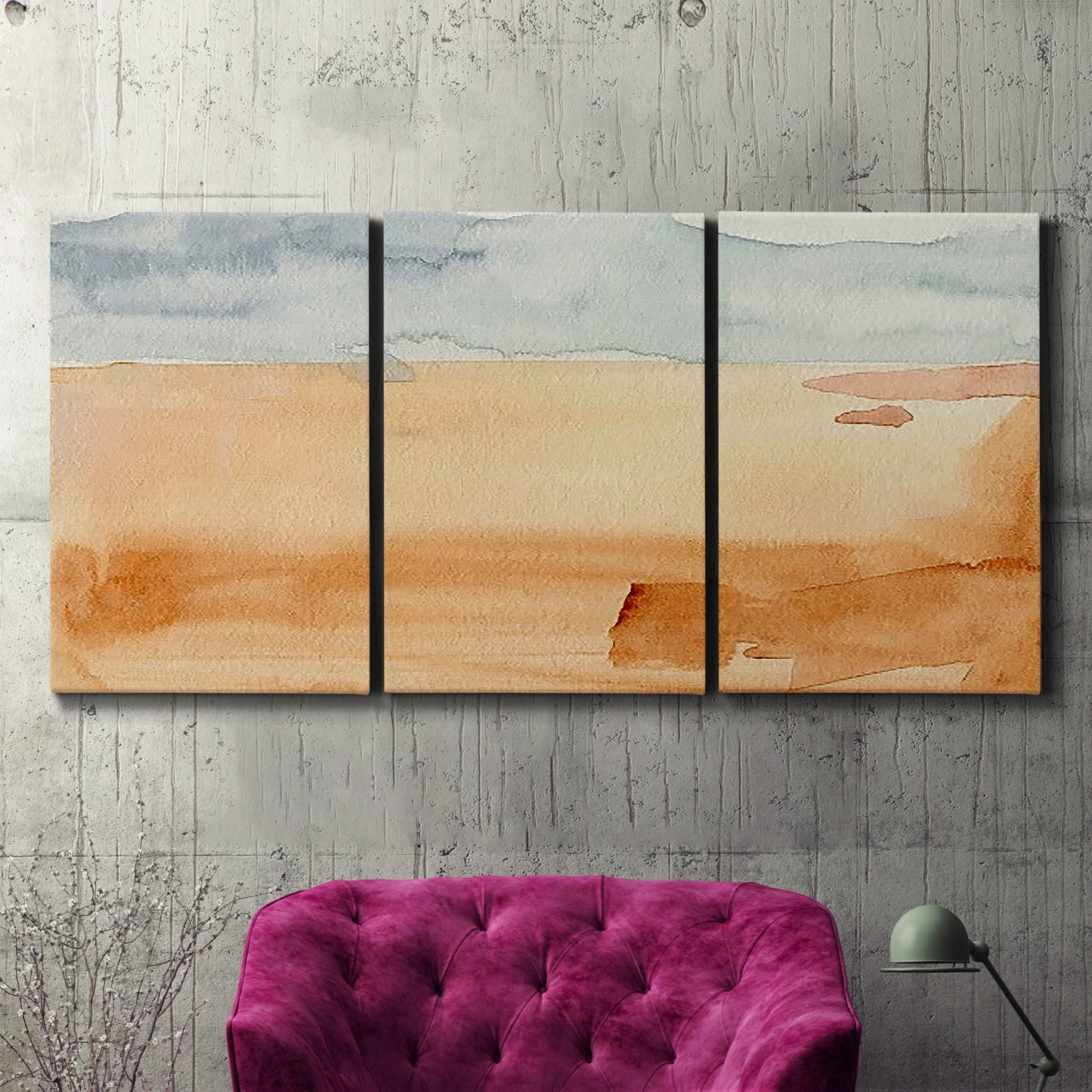 Three-panel canvas wall art featuring minimal horizon with soft blue tones, displayed in a living room above a suede accent chair.